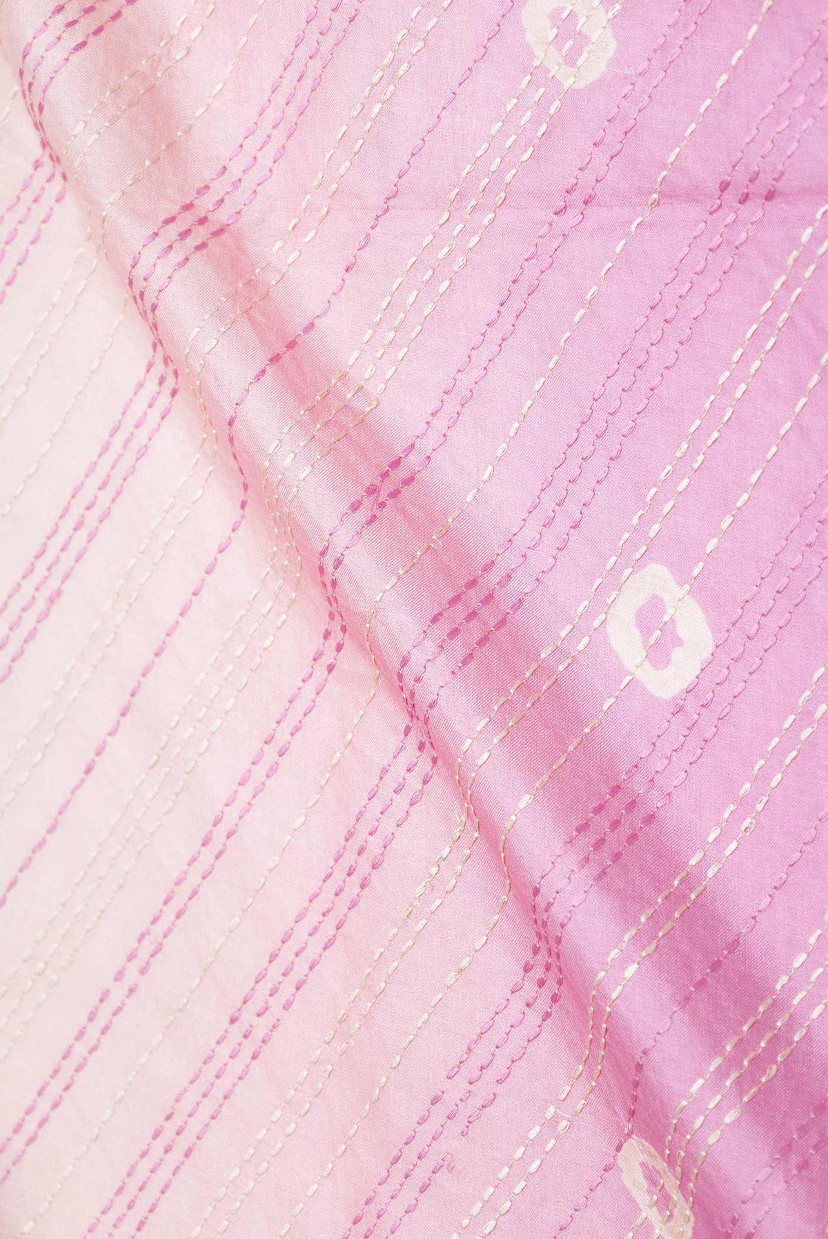 Close up of Multi Color Tussar Silk Saree with Embroidery on the body and Embroidery Border displaying folds