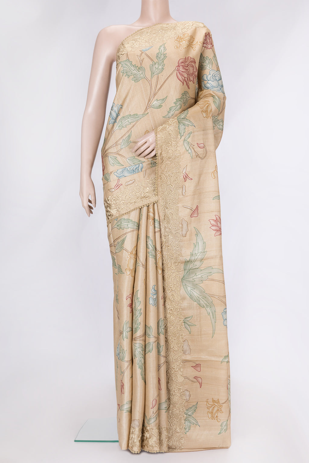 Beige Dual Tone Tussar Silk Saree with Printed design on the body and Embroidery Border.  displayed on a mannequin
