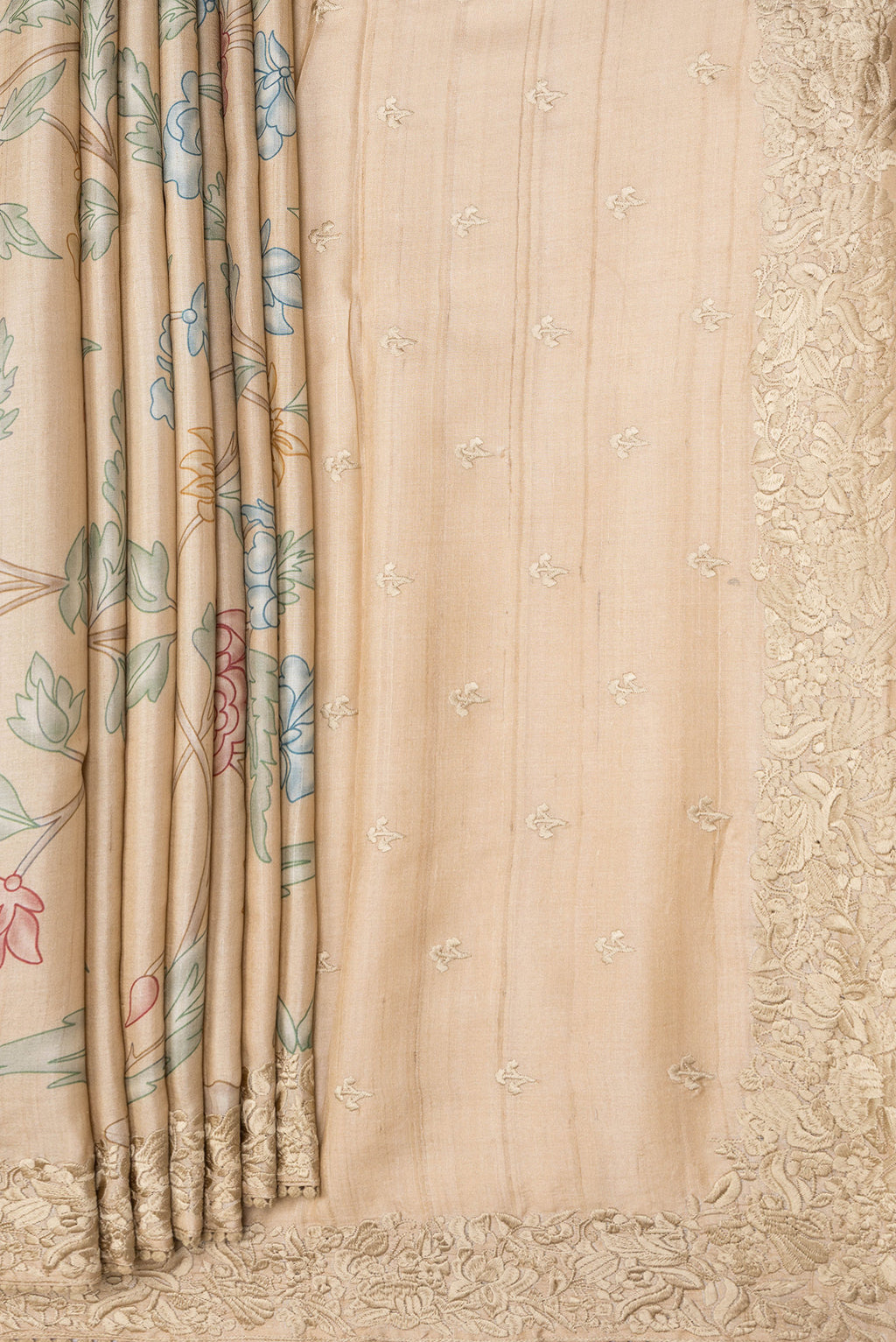 Pleats and pallu of Beige Dual Tone Tussar Silk Saree with Printed design on the body and Embroidery Border. 
