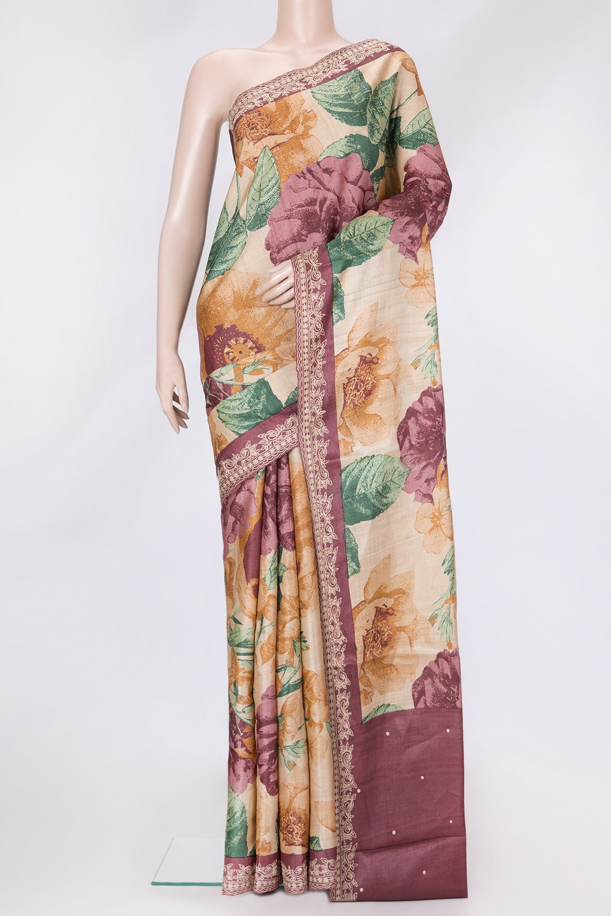 Beige Dual Tone Tussar Silk Saree with Printed design on the body and Embroidery Border.  displayed on a mannequin
