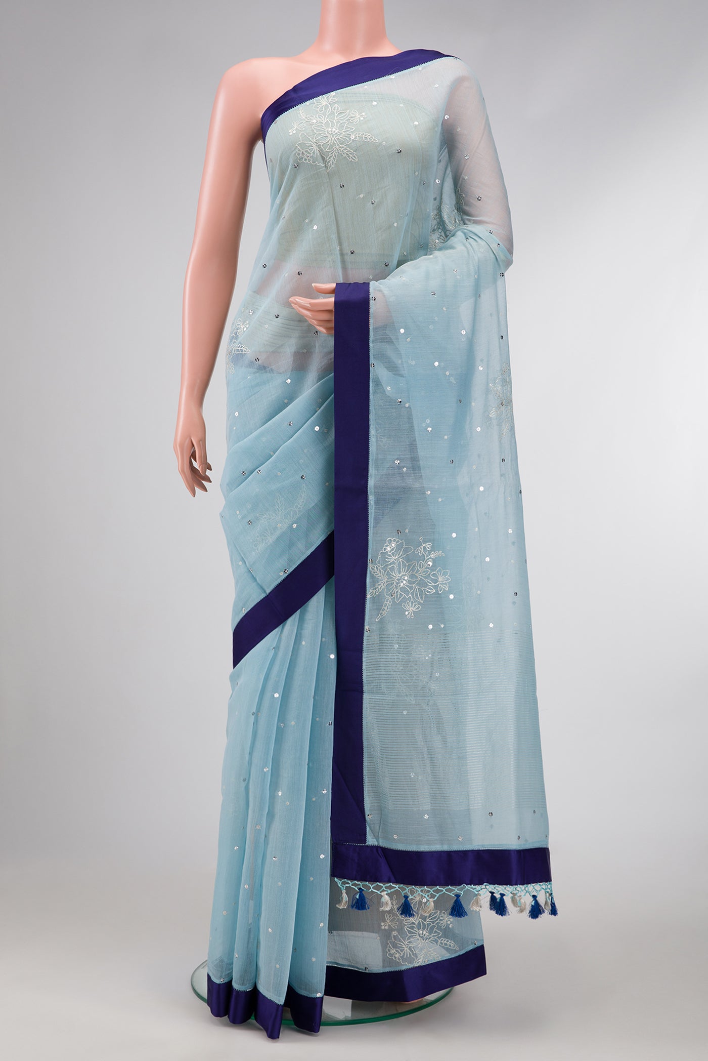 Light Blue Dual Tone Organza Silk Saree with Embroidery on the body and Plain Border.  displayed on a mannequin