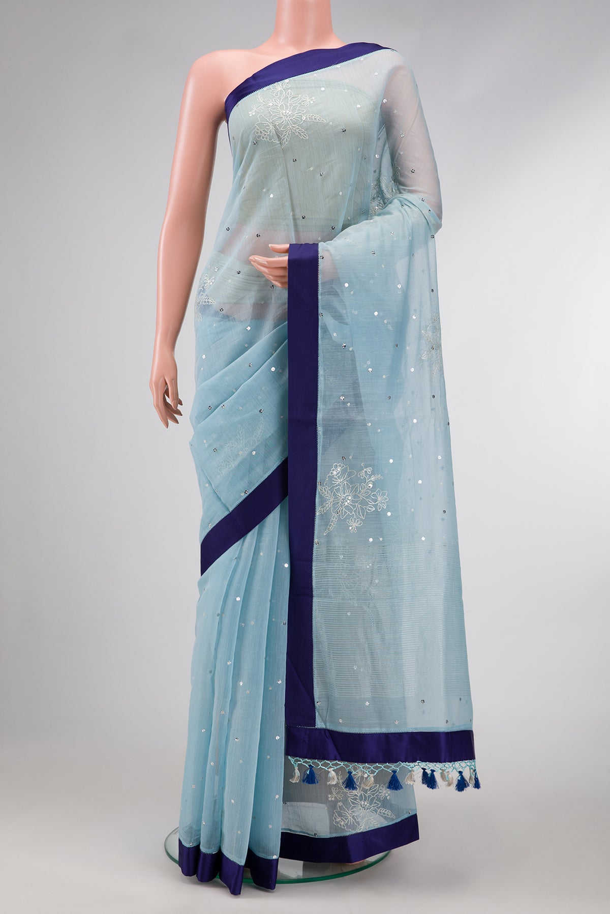 Light Blue Dual Tone Organza Silk Saree with Embroidery on the body and Plain Border.  displayed on a mannequin