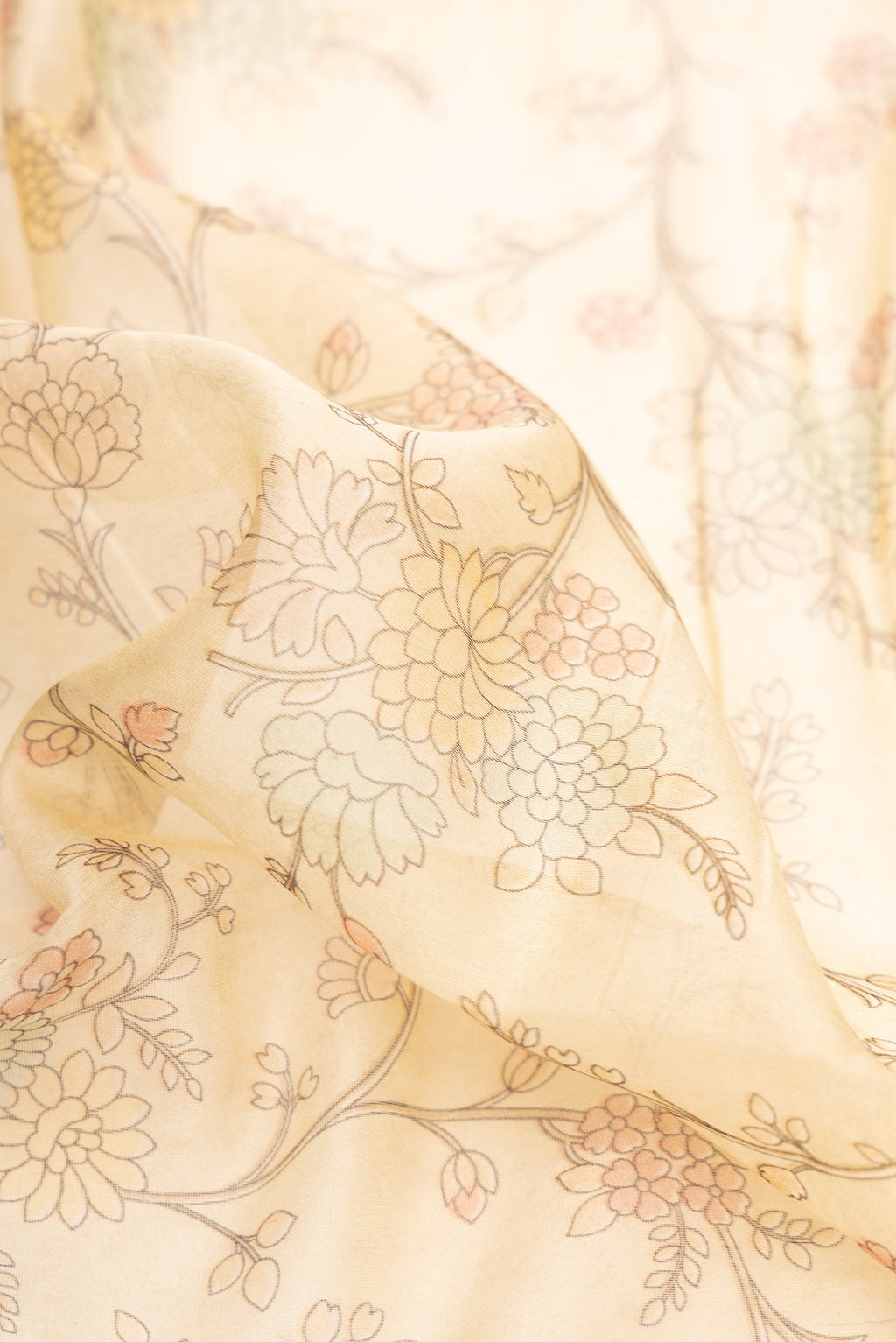 Close up of Sandal Dual Tone Chanderi Silk Saree with Printed design on the body and Embroidery Border.  displaying folds