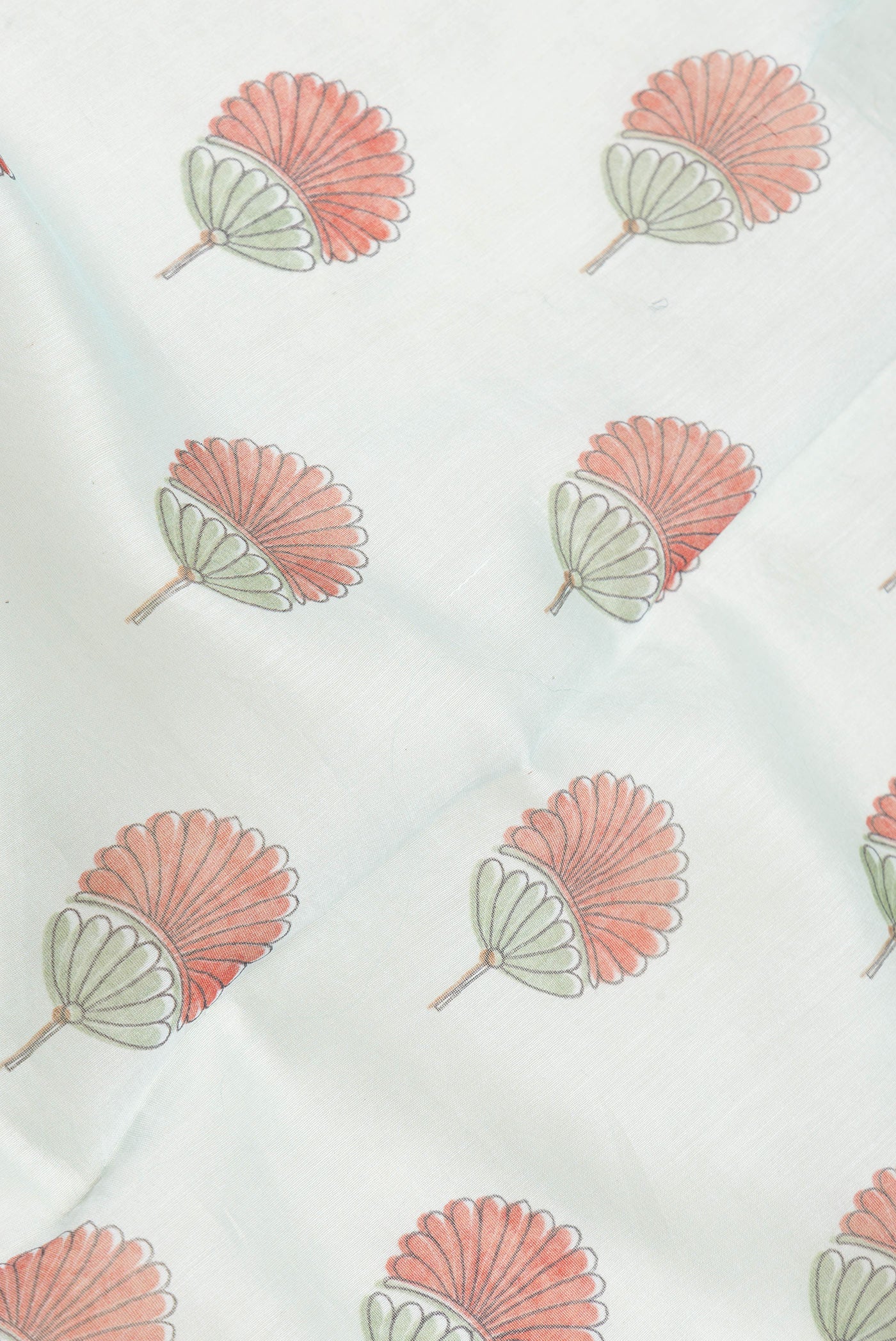 Close up of Sea Green Dual Tone Chanderi Silk Saree with Printed design on the body and Embroidery Border.  displaying folds