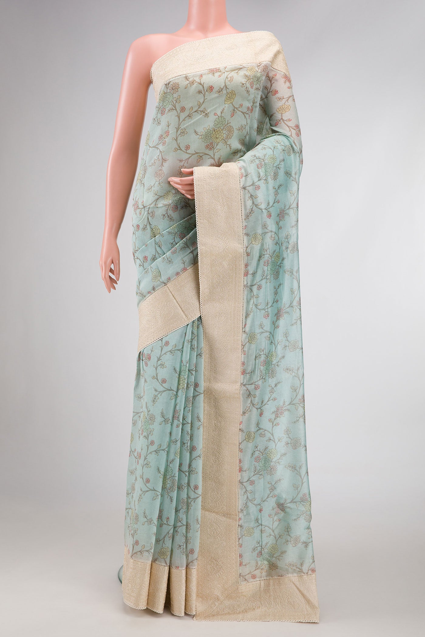 Light Blue Dual Tone Chanderi Silk Saree with Printed design on the body and Embroidery Border.  displayed on a mannequin