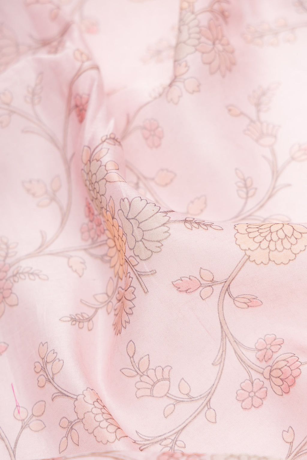 Close up of Pink Dual Tone Chanderi Silk Saree with Printed design on the body and Embroidery Border.  displaying folds