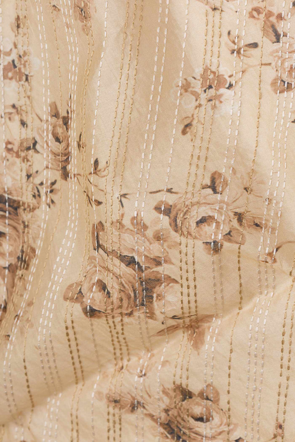 Close up of Beige Dual Tone Tussar Saree with Embroidery on the body and Thread Border displaying folds