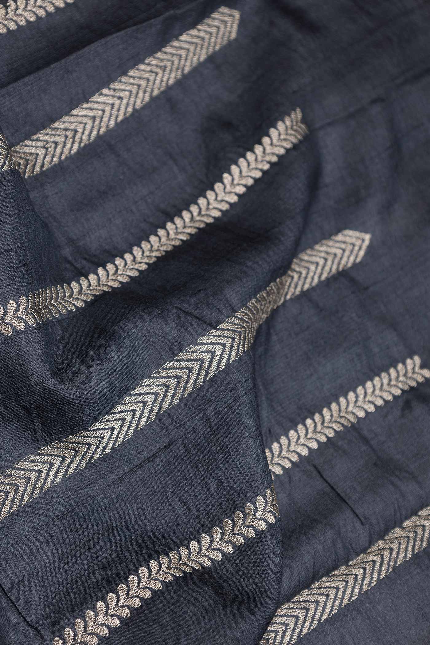 Close up of Black Dual Tone Tussar Saree with Embroidery on the body and Embroidery Border displaying folds