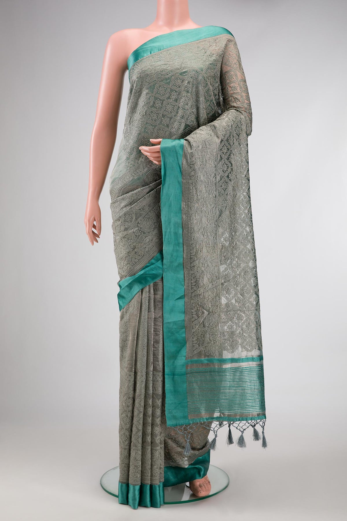 Grey Dual Tone Mysore Georgette Saree with Embroidery on the body and Plain Border.  displayed on a mannequin