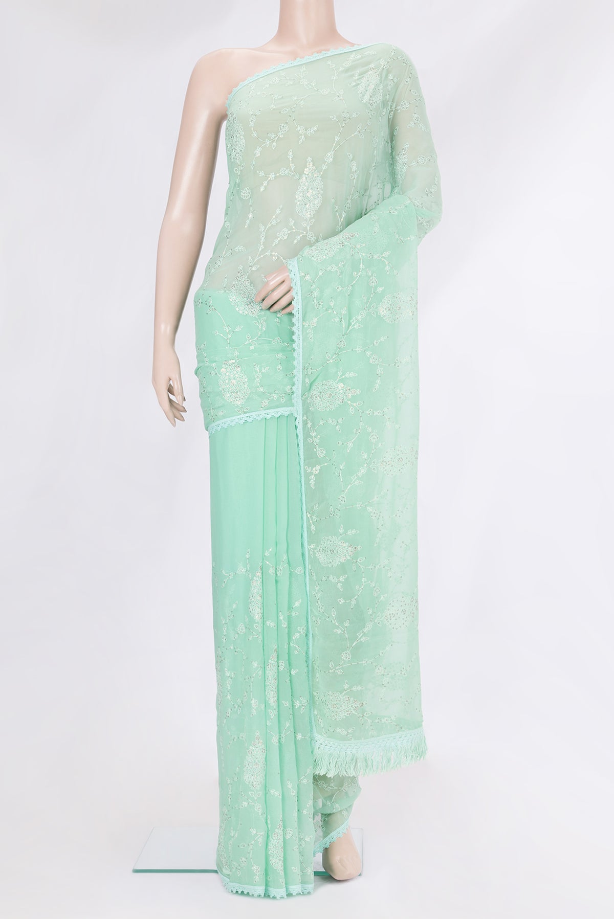 Sea Green Blended Chiffon Saree with Embroidery on the body and Embroidery Border.  displayed on a mannequin
