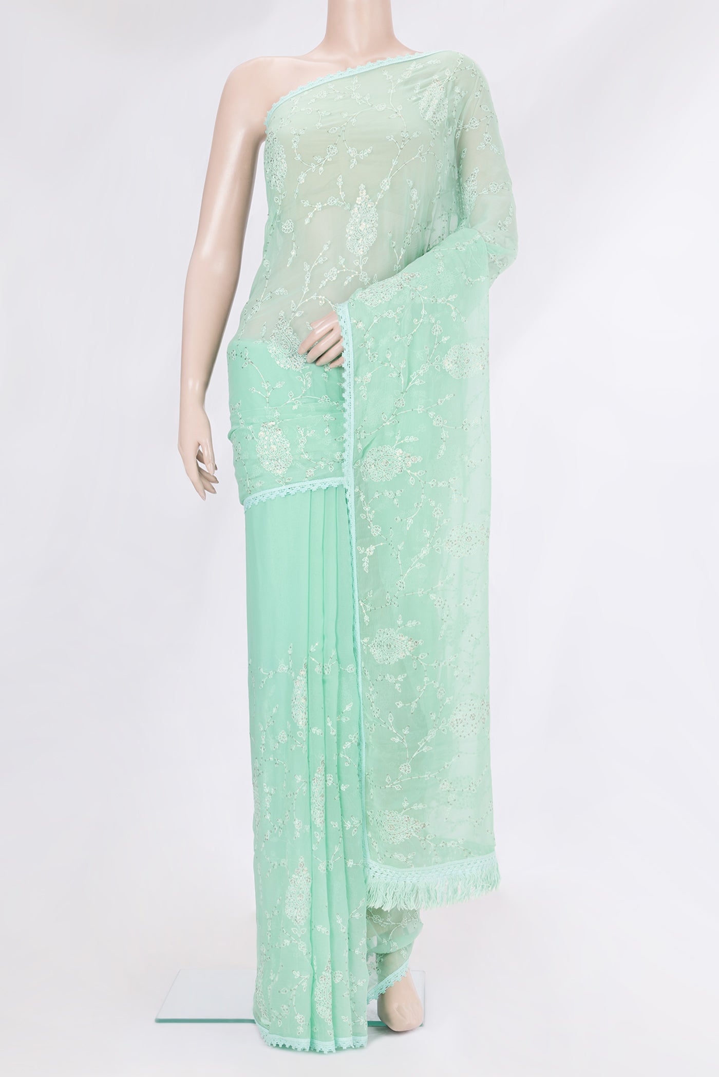 Sea Green Blended Chiffon Saree with Embroidery on the body and Embroidery Border.  displayed on a mannequin