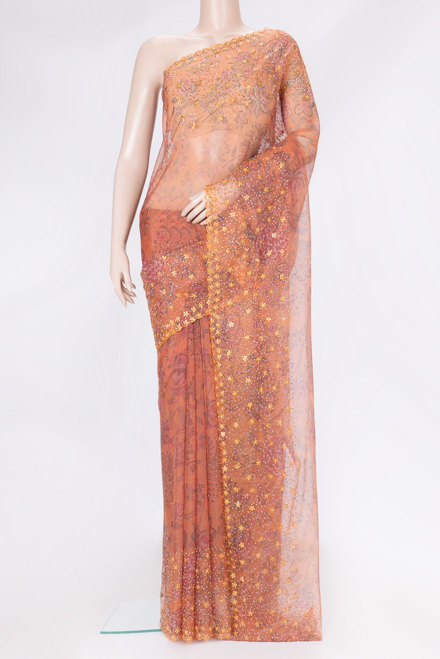 Orange Dual Tone Organza Silk Saree with Printed design on the body and Embroidery Border.  displayed on a mannequin