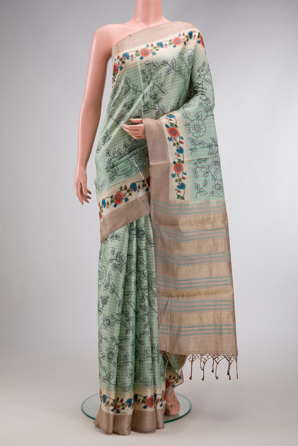 Sea Green Dual Tone Tussar Silk Saree with Printed design on the body and Fancy Border.  displayed on a mannequin