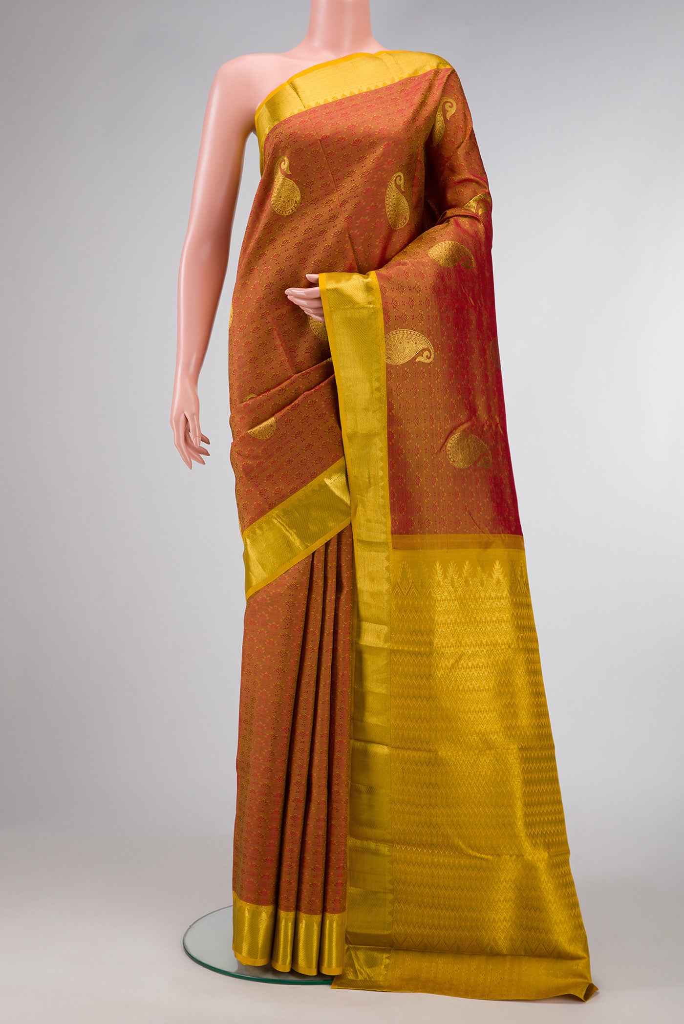 Bronze Dual Tone Kanchipuram Silk Saree with Jacquard With Zari Butta on the body and Zari Border.  displayed on a mannequin
