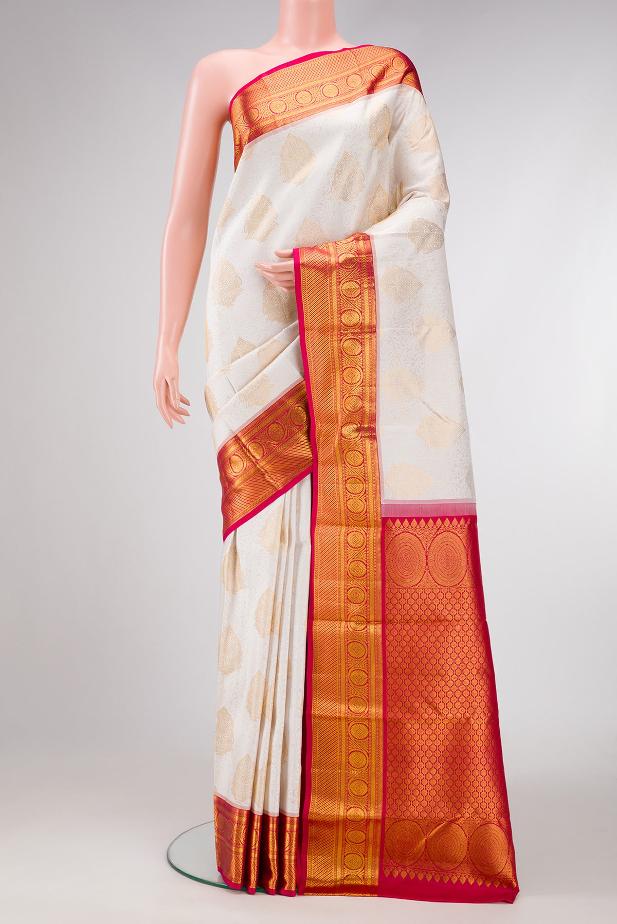 White Dual Tone Kanjivaram Silk Saree with Zari Brocade on the body and Zari Border.  displayed on a mannequin