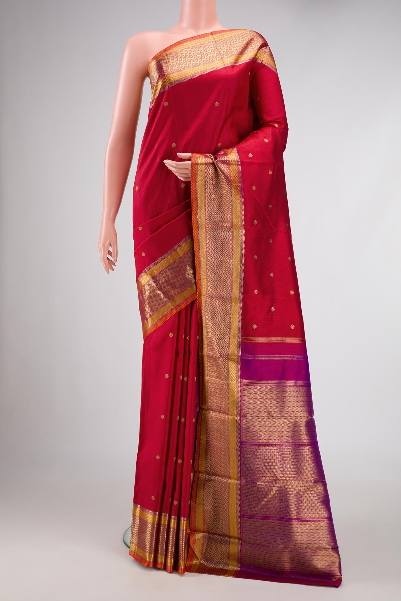 Pure Silk Pure Zari Red Dual Tone Kanchipuram Saree with Zari Butta on the body and Zari Border displayed on a mannequin