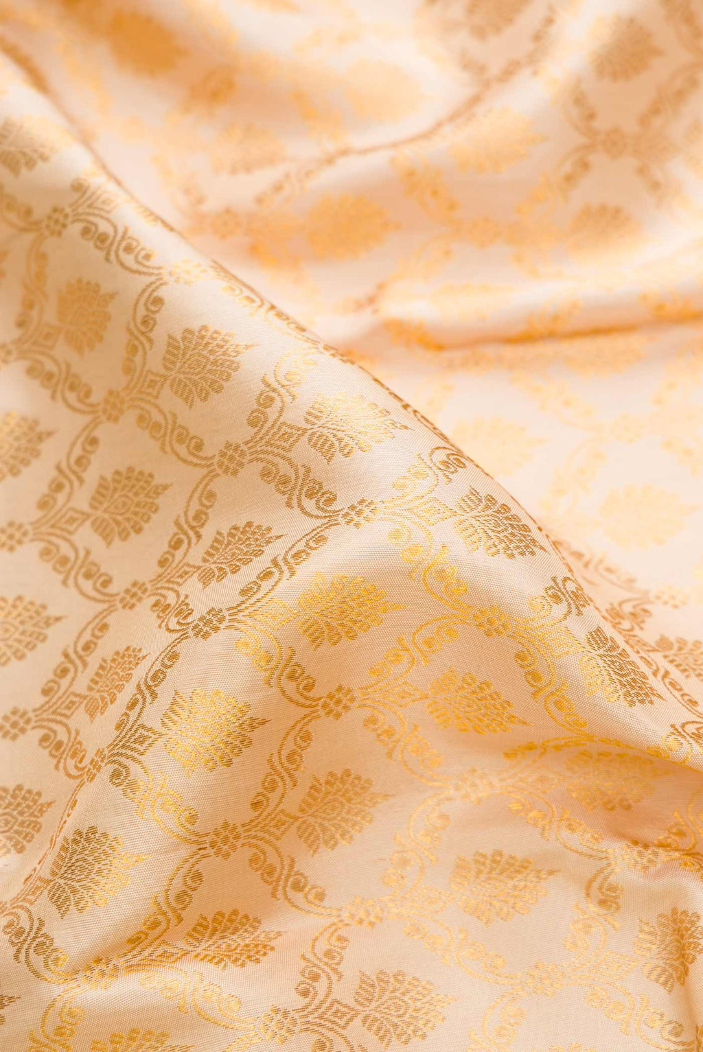 Close up of Sandal Dual Tone Kanchipuram Saree with Zari Brocade on the body and Zari Border displaying folds