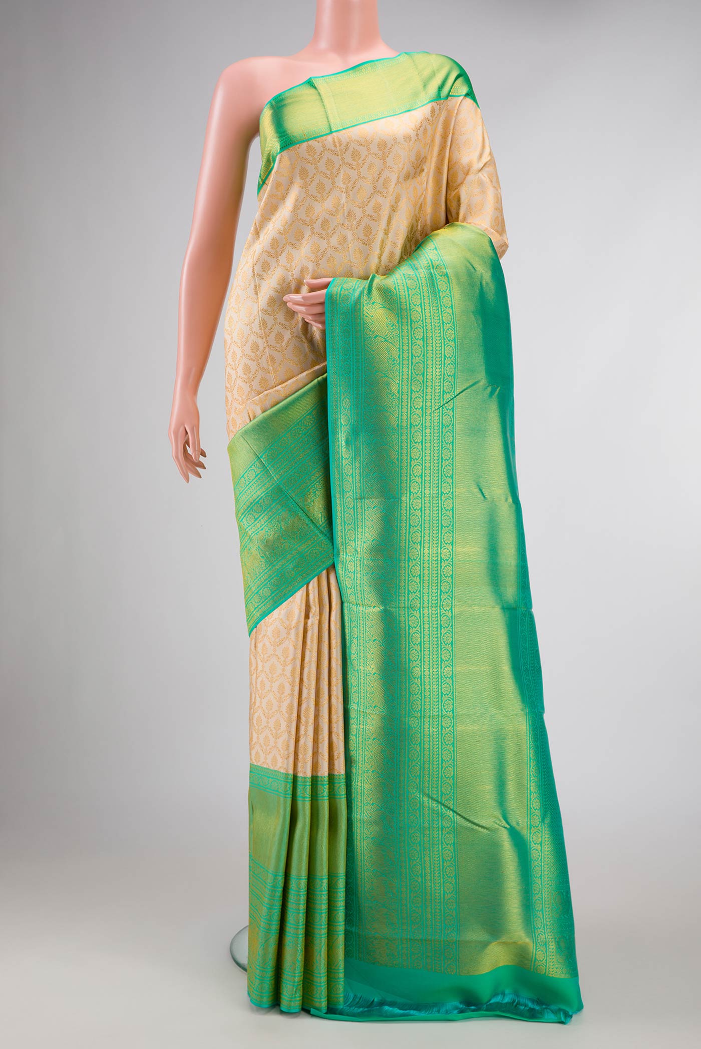 Sandal Dual Tone Kanchipuram Saree with Zari Brocade on the body and Zari Border displayed on a mannequin