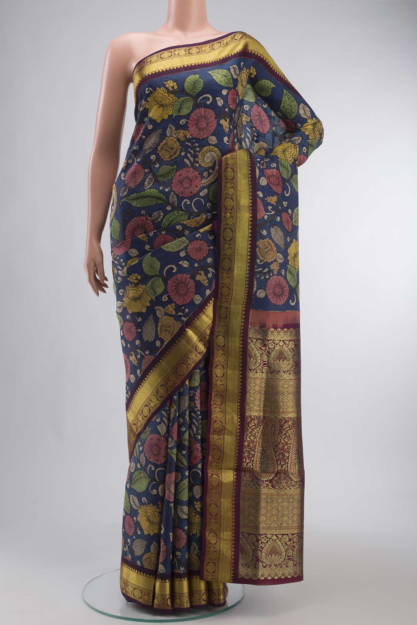 Blue Kanchipuram Silk Saree with Printed design on the body and Zari Border displayed on a mannequin