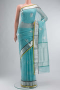 Green Kota Silk Saree with Zari And Thread Butta on the body and Zari Border displayed on a mannequin
