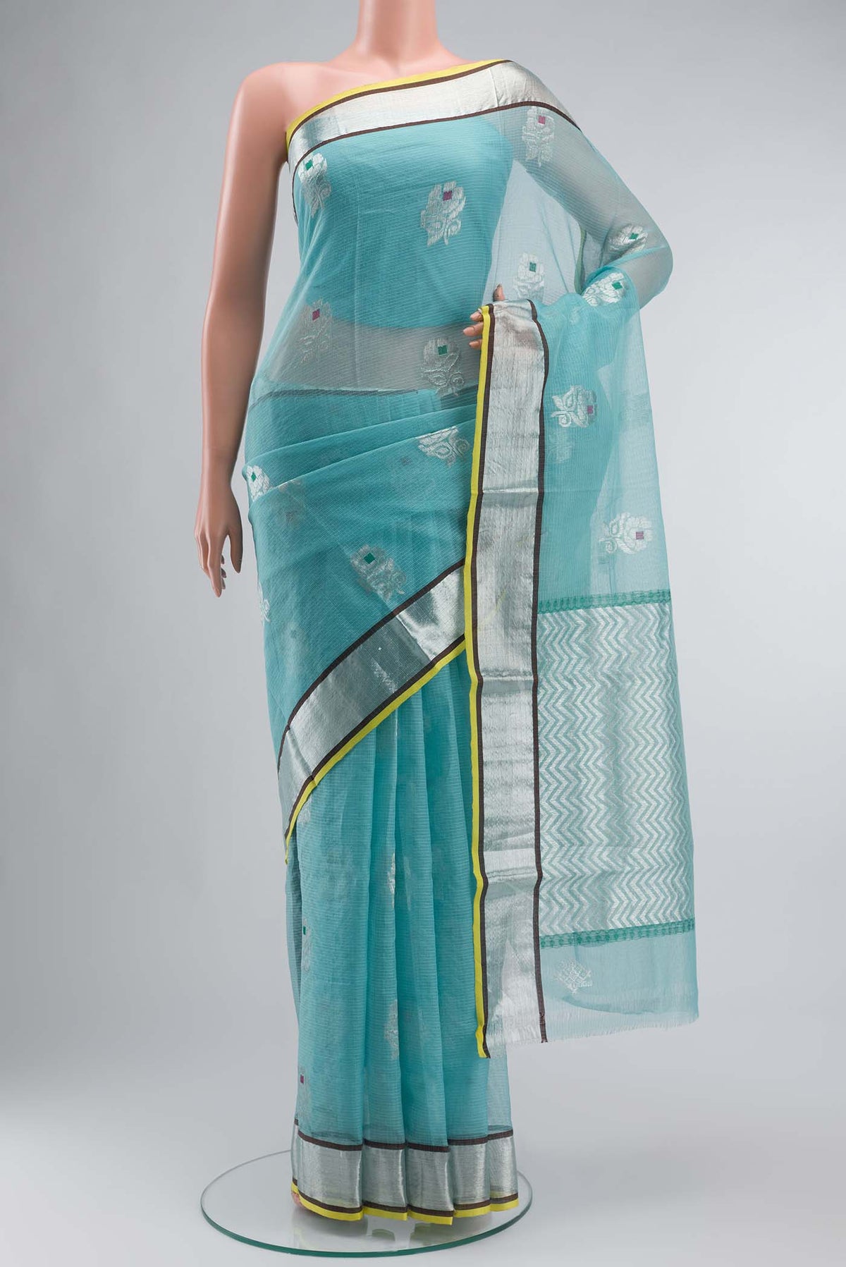 Green Kota Silk Saree with Zari And Thread Butta on the body and Zari Border displayed on a mannequin