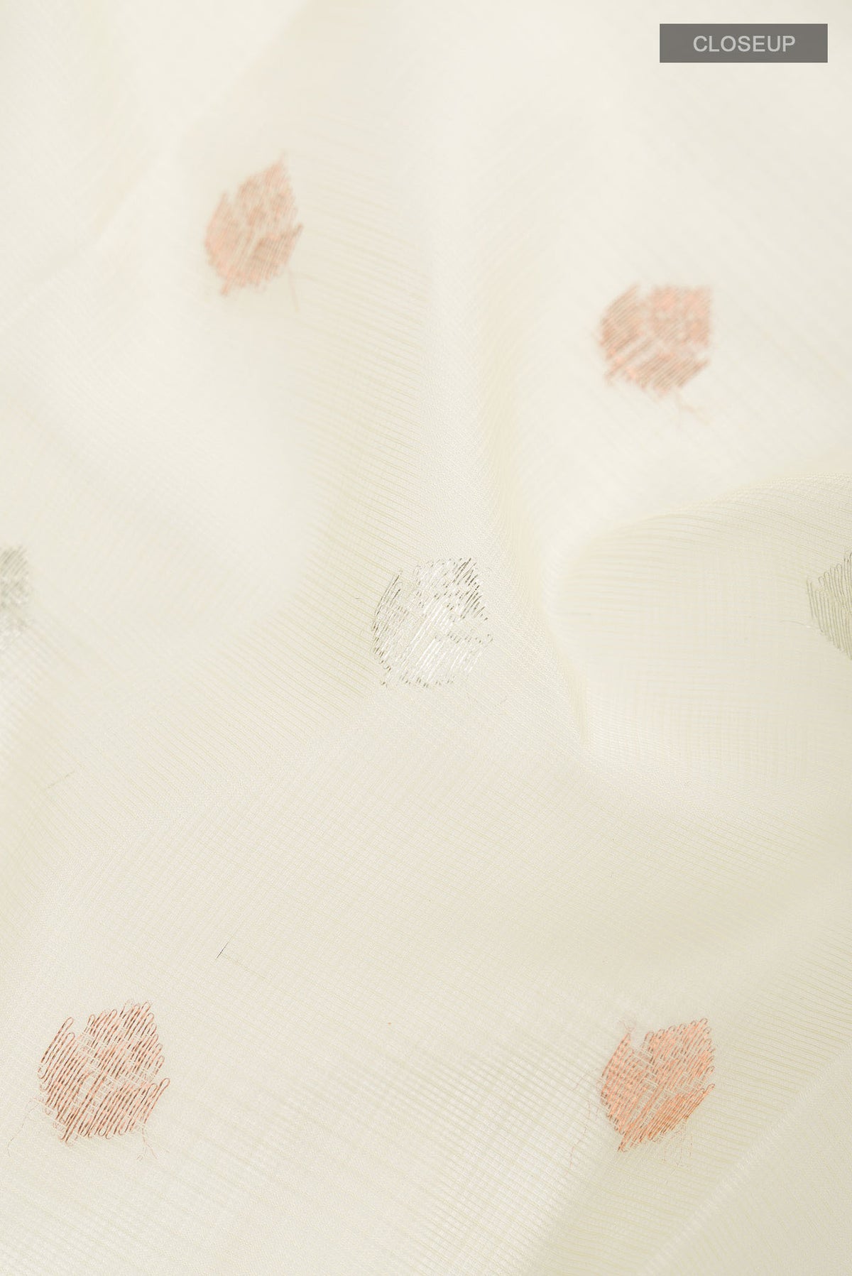 Close up of Yellow Kota Silk Saree with Zari Butta on the body and Zari Border displaying folds