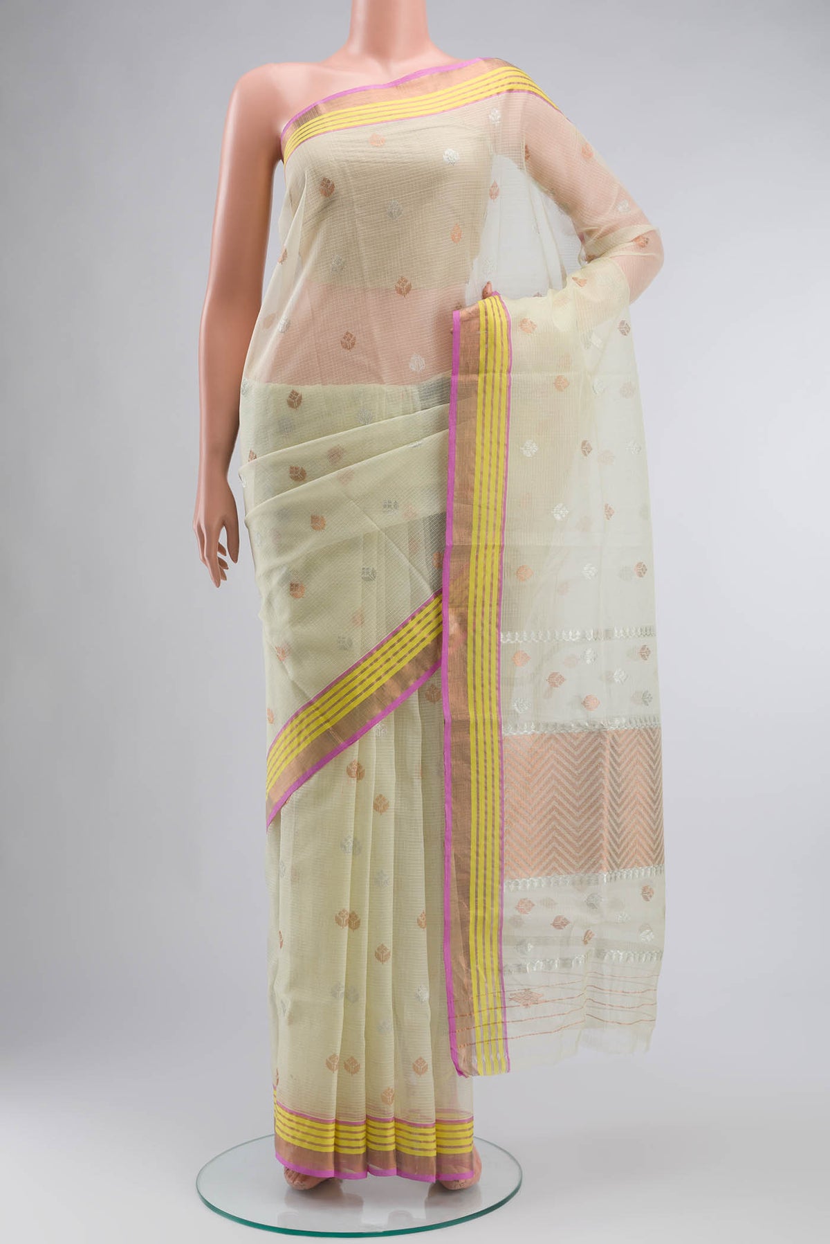 Yellow Kota Silk Saree with Zari Butta on the body and Zari Border displayed on a mannequin