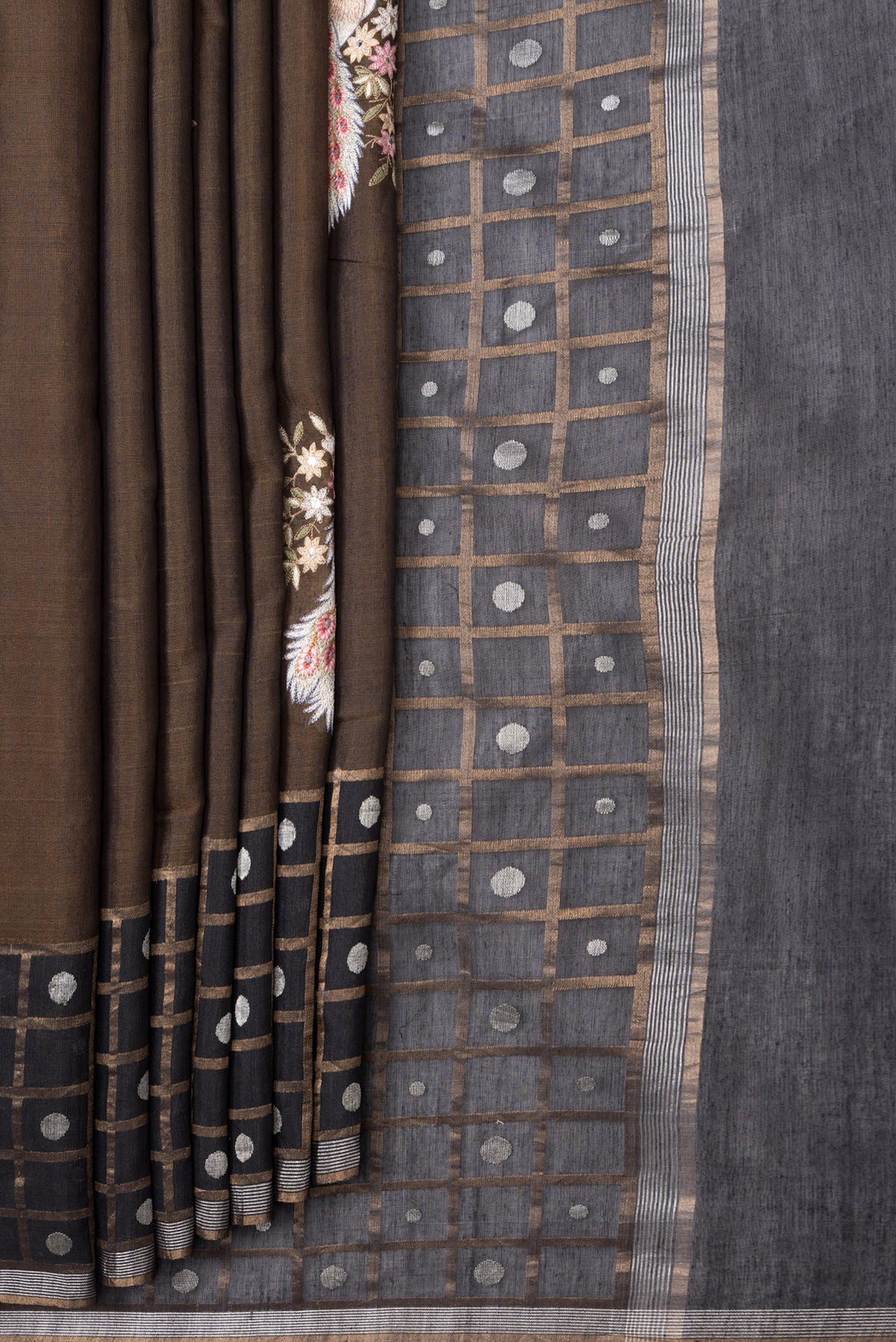 Pleats and pallu of Brown Dual Tone Tussar Silk Saree with Embroidery on the body and Checks Border. 