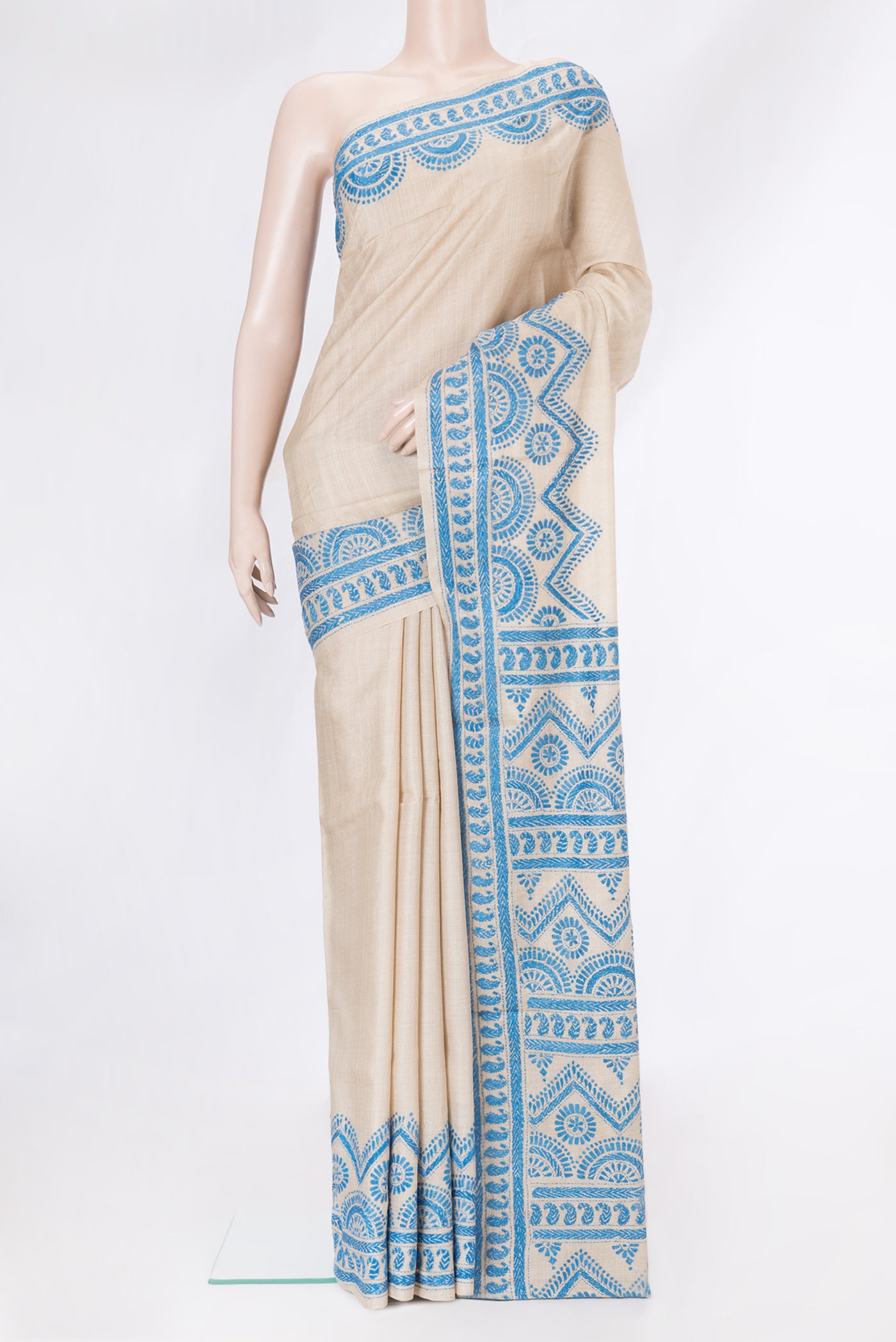 Beige Dual Tone Tussar Silk Saree with Plain Body and Embroidery Border.  displayed on a mannequin