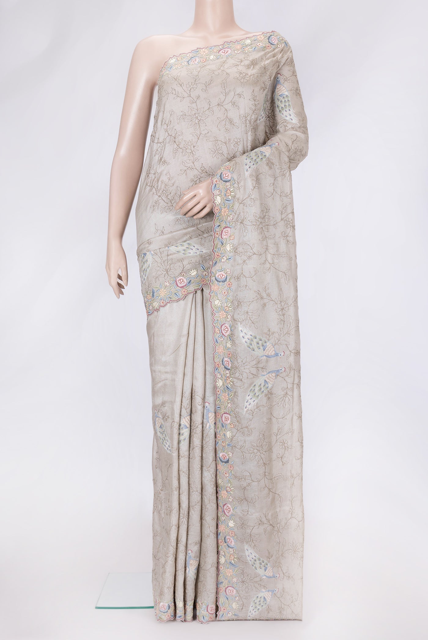 Grey Dual Tone Tussar Silk Saree with Embroidery on the body and Embroidery Border.  displayed on a mannequin