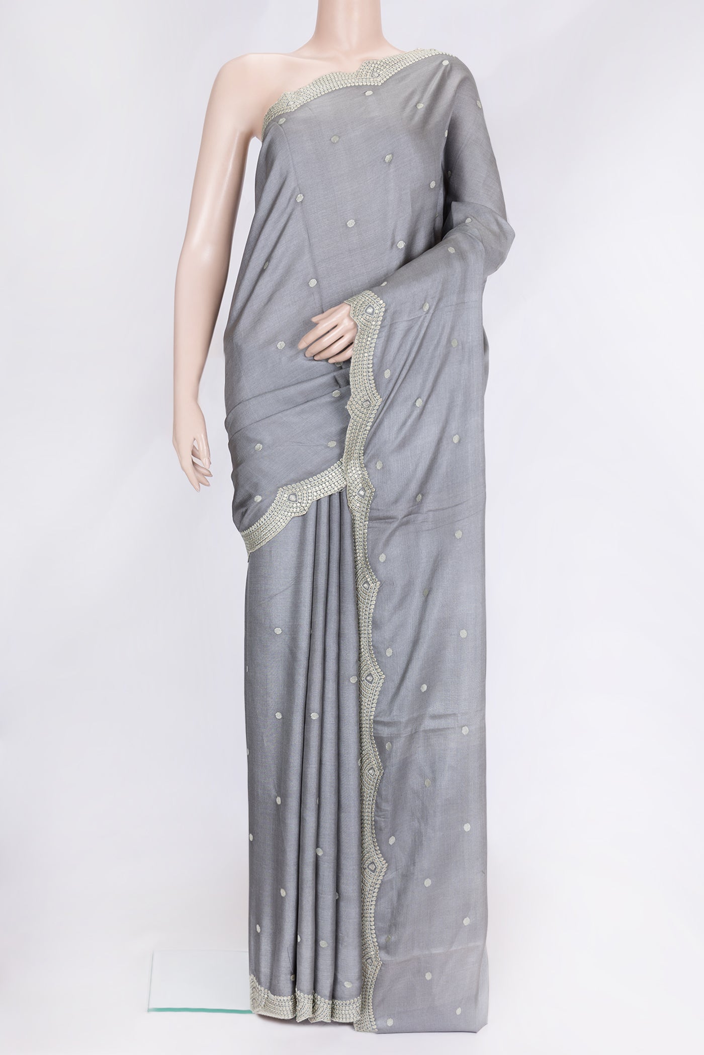 Grey Dual Tone Tussar Silk Saree with Embroidery on the body and Embroidery Border.  displayed on a mannequin