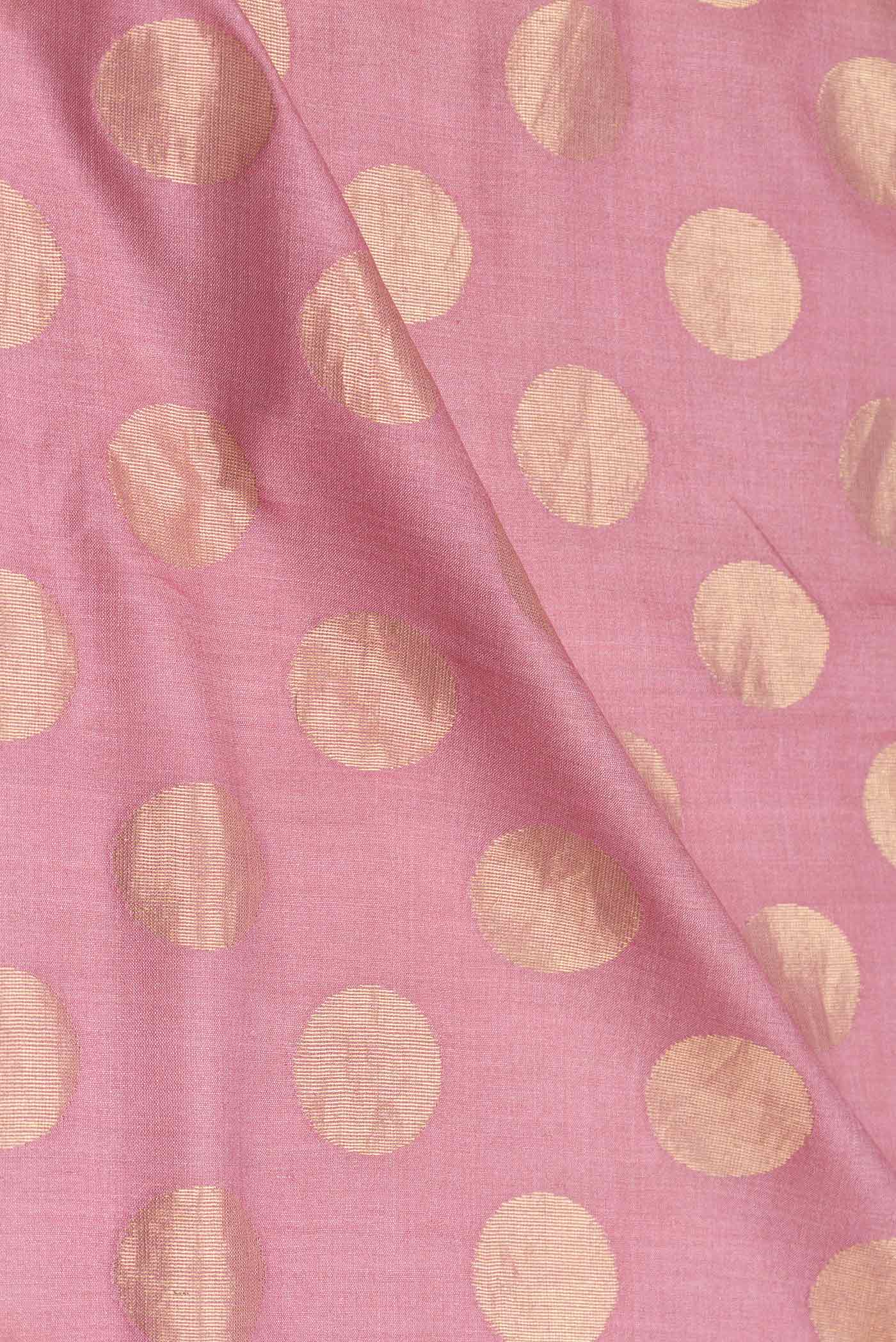 Close up of Pink Dual Tone Tussar Silk Saree with Zari Butta on the body and Embroidery Border displaying folds