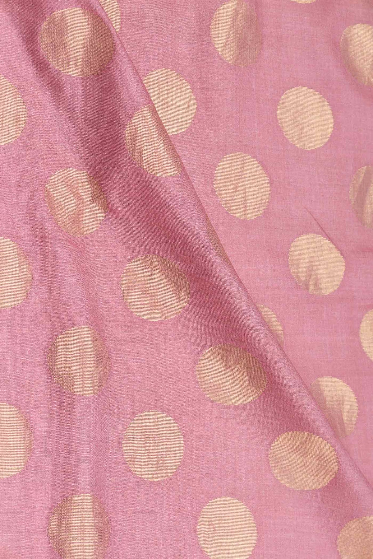 Close up of Pink Dual Tone Tussar Silk Saree with Zari Butta on the body and Embroidery Border displaying folds