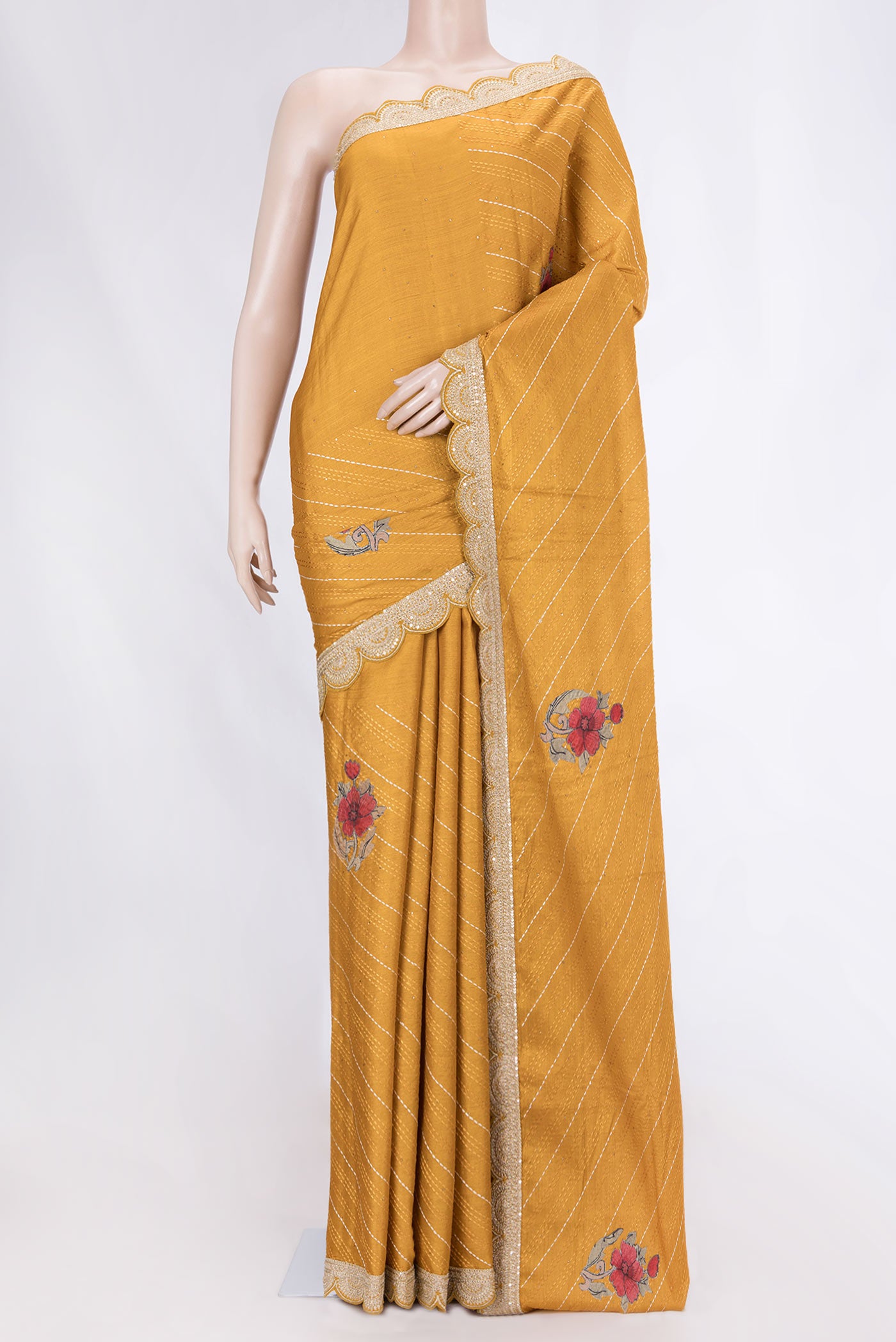 Mustard Tussar Silk Saree with Embroidery on the body and Embroidery Border displayed on a mannequin