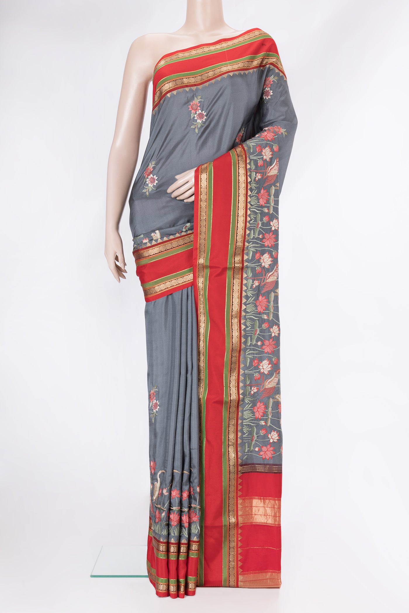 Grey Dual Tone Kanchipuram Silk Saree with Embroidery on the body and Zari Border.  displayed on a mannequin