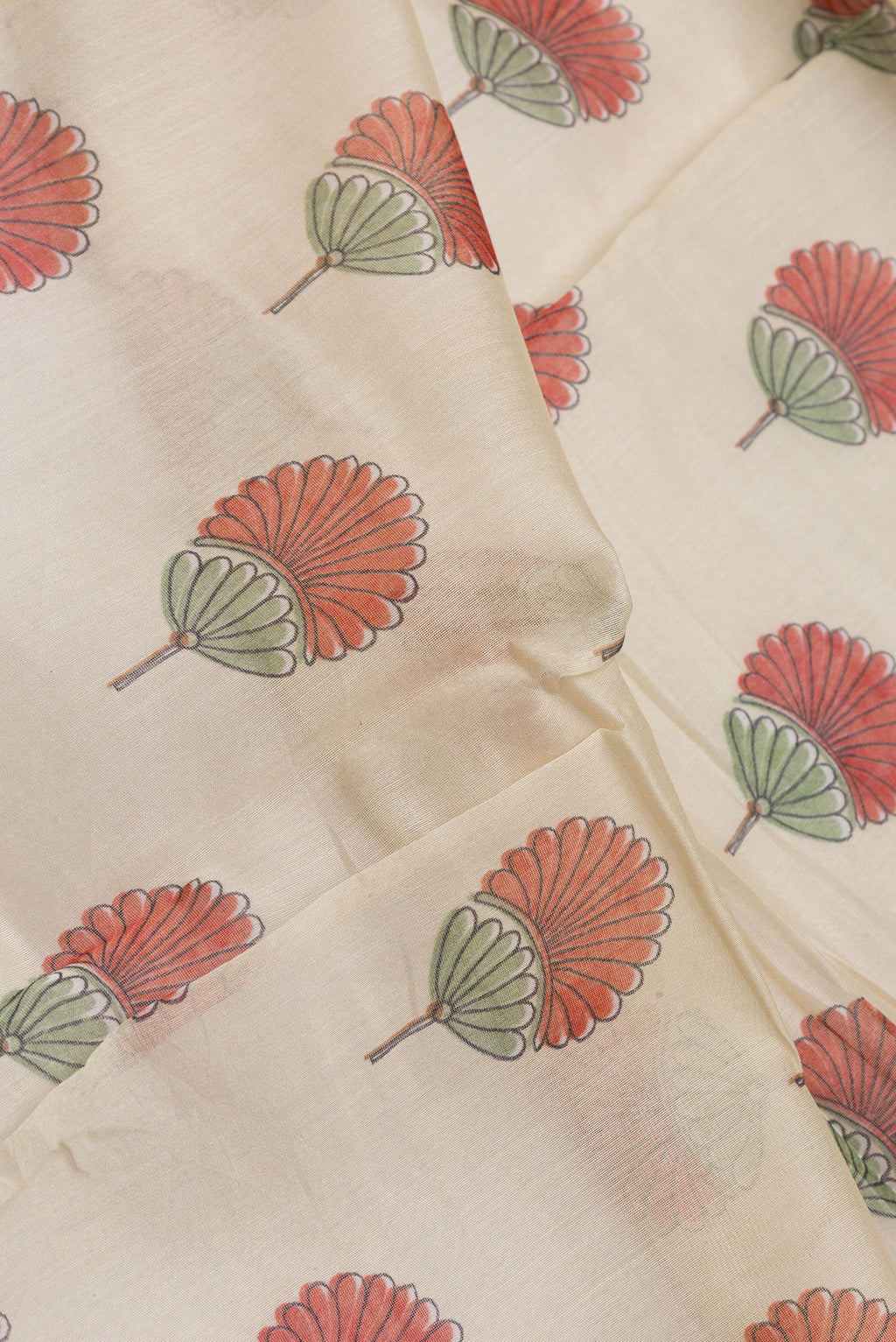 Close up of Sandal Dual Tone Chanderi Silk Saree with Printed design on the body and Embroidery Border.  displaying folds