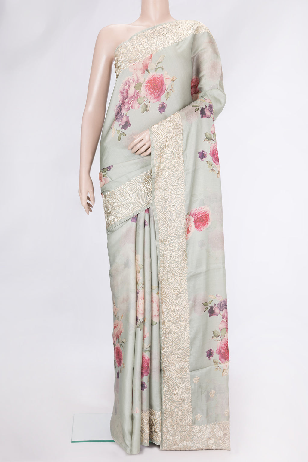 Pista Green Dual Tone Tussar Silk Saree with Printed design on the body and Embroidery Border.  displayed on a mannequin