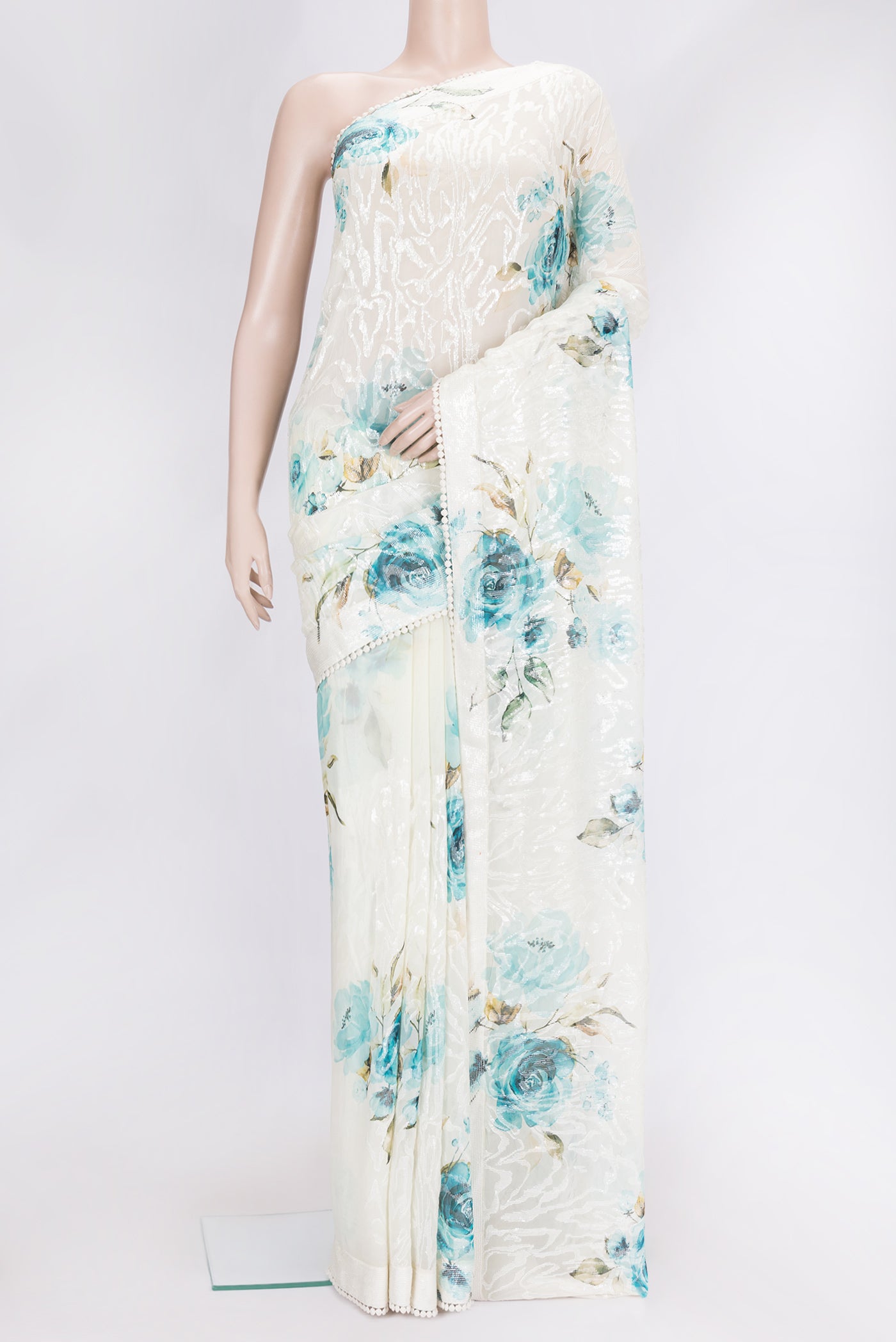 Lavender and Sea Green Color Georgette Saree with Embroidery on the body and Embroidery Border.  displayed on a mannequin
