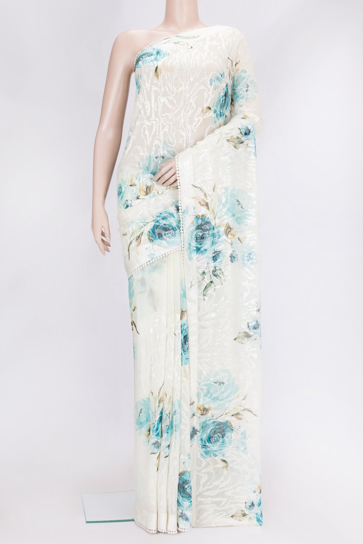 Lavender and Sea Green Color Georgette Saree with Embroidery on the body and Embroidery Border.  displayed on a mannequin