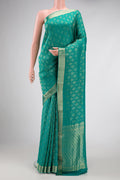 Peacock Blue Dual Tone Banarasi Georgette Saree with Zari Brocade on the body and Zari Border.  displayed on a mannequin