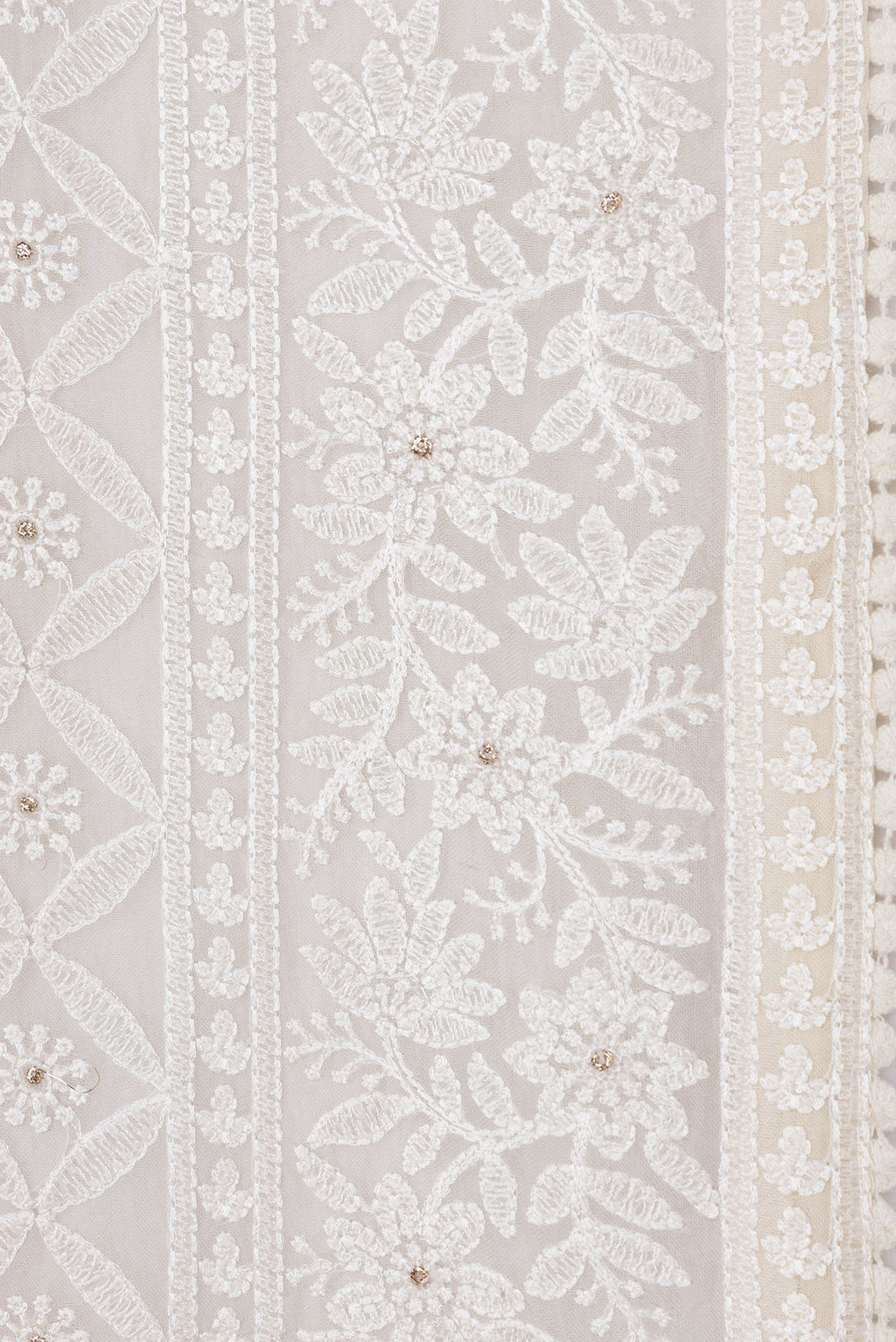 Border image of Golden Peach Dual Tone Organza Silk Saree with Embroidery on the body and Embroidery Border. 