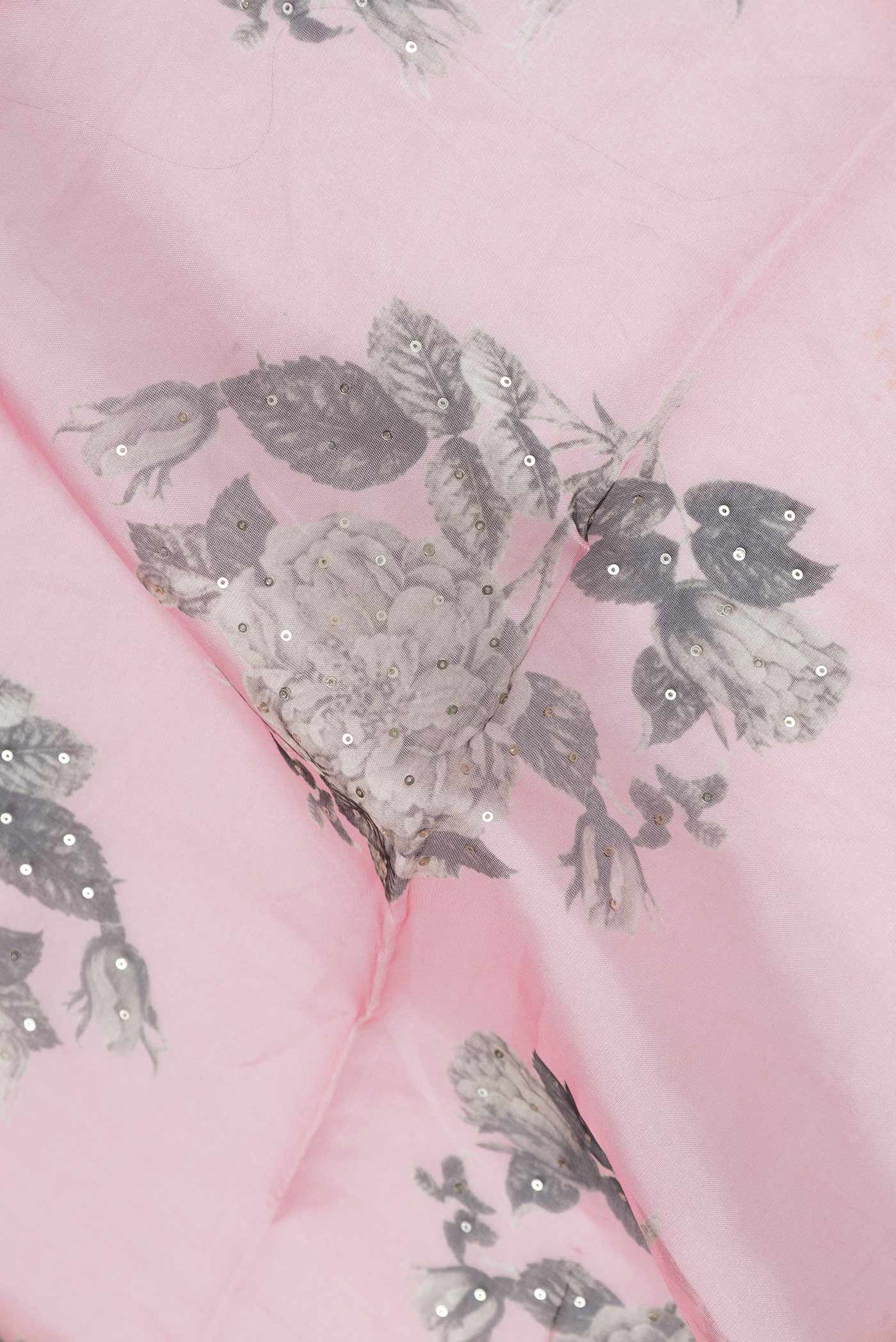 Close up of Pink Dual Tone Organza Silk Saree with Printed design on the body and Zari Border.  displaying folds