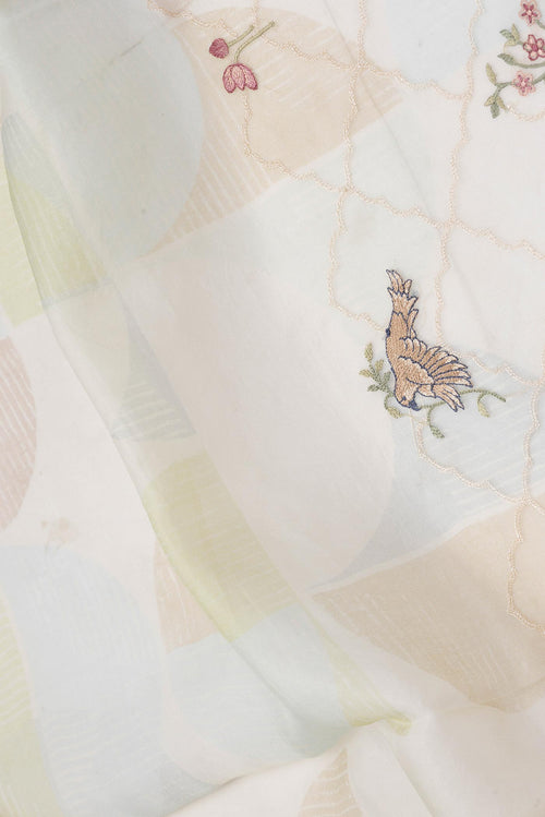 Close up of Beige Dual Tone Organza Silk Saree with Embroidery on the body and Fancy Border displaying folds