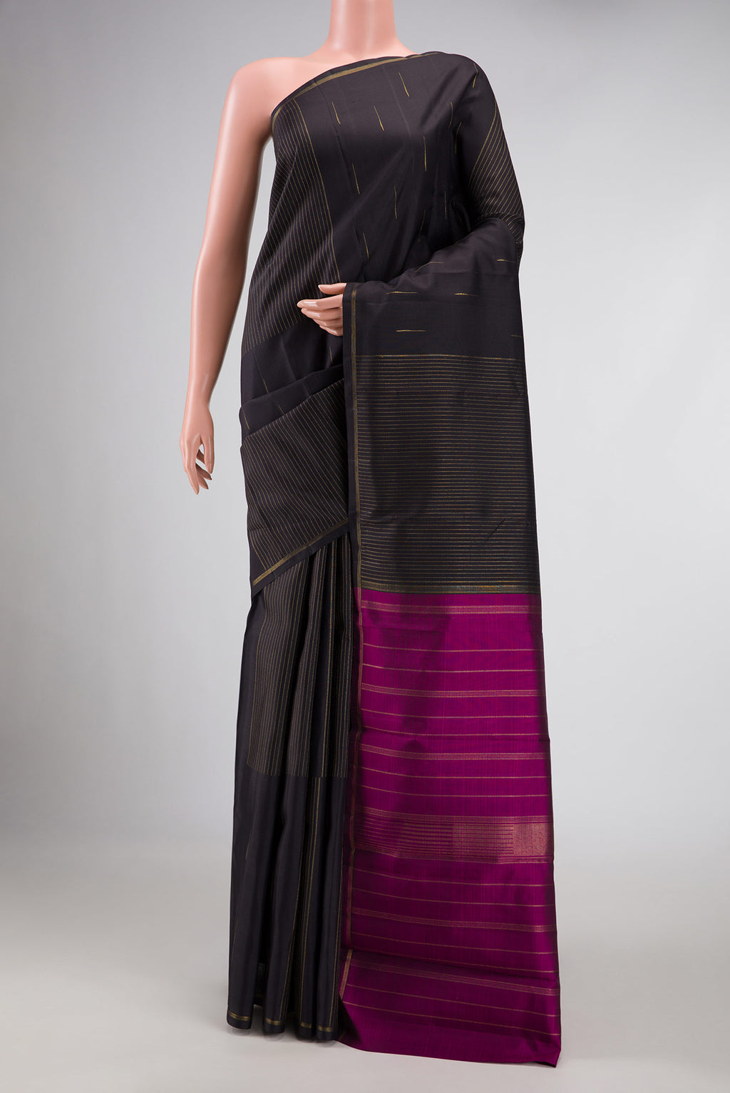 Pure Silk Pure Zari Coffee Brown Dual Tone Kanchipuram Saree with Zari Butta on the body and Thin Zari Line displayed on a mannequin