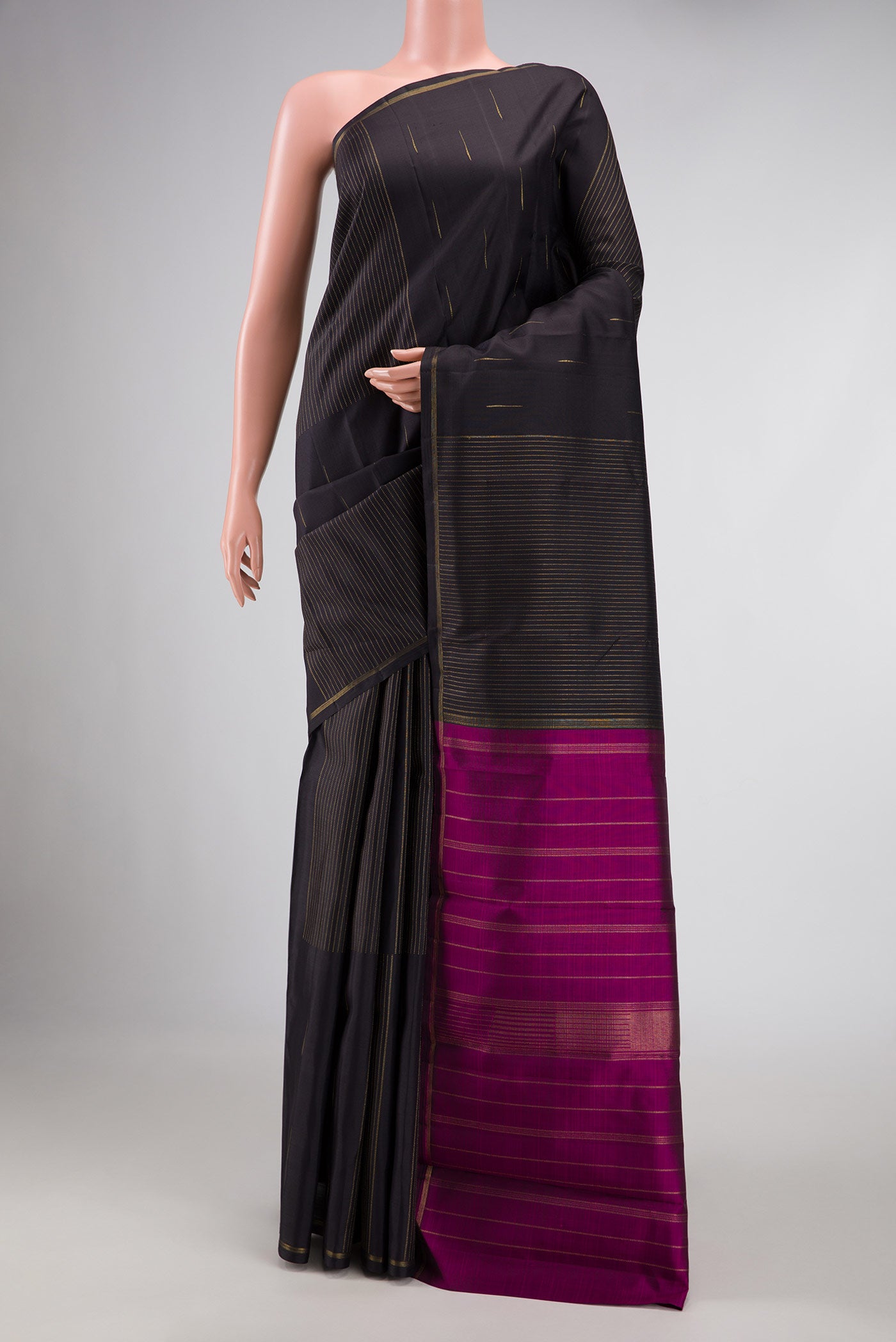 Pure Silk Pure Zari Coffee Brown Dual Tone Kanchipuram Saree with Zari Butta on the body and Thin Zari Line displayed on a mannequin