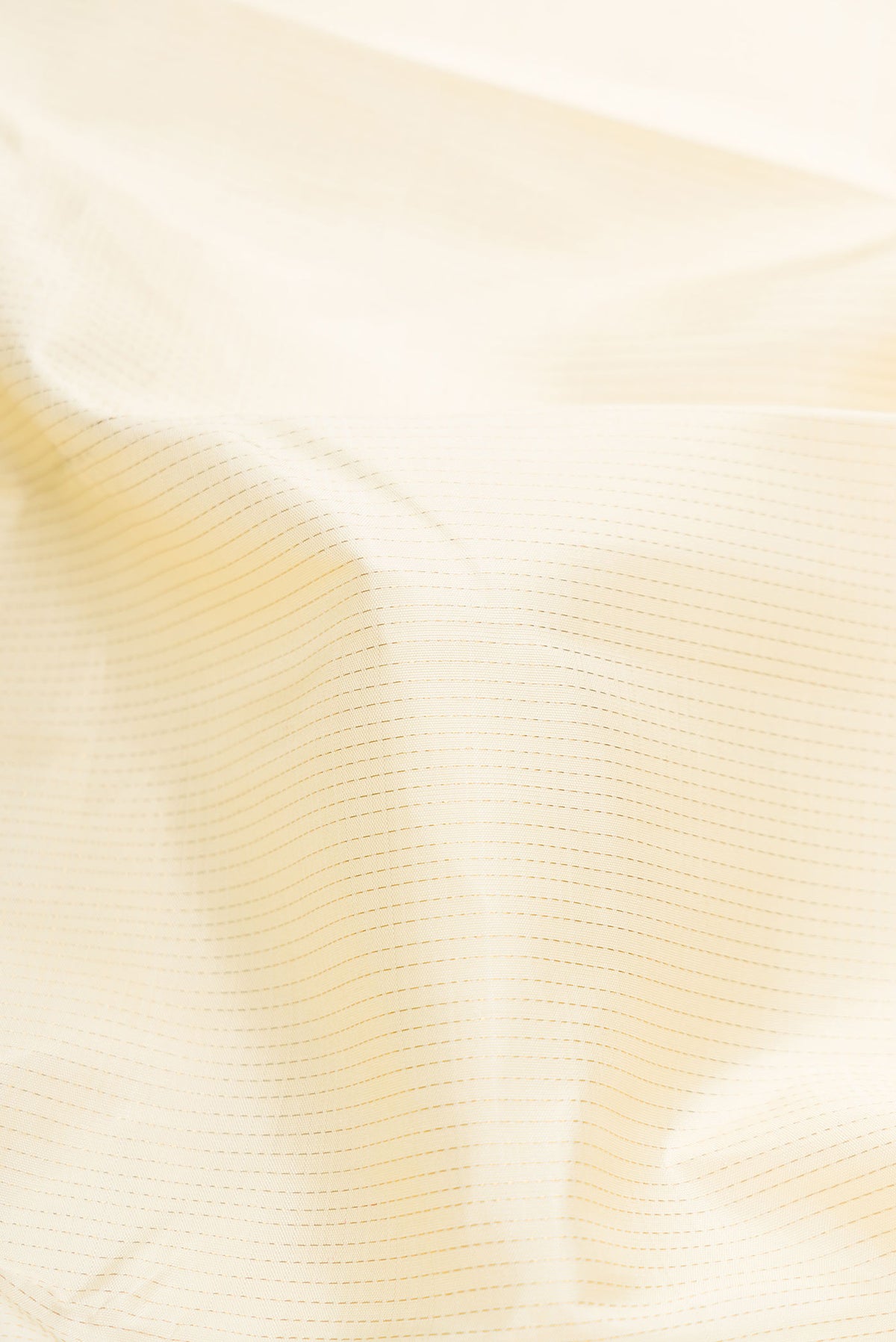 Close up of Sandal Dual Tone Kanchipuram Silk Saree with Stripes on the body and Thin Zari Line displaying folds