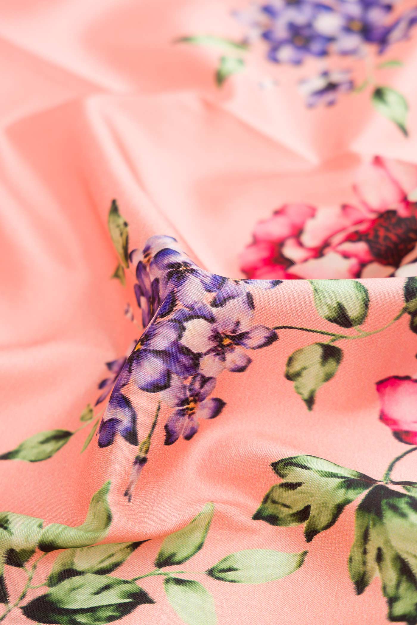 Close up of Pink Dual Tone Kanchipuram Silk Saree with Printed design on the body and Zari Border.  displaying folds