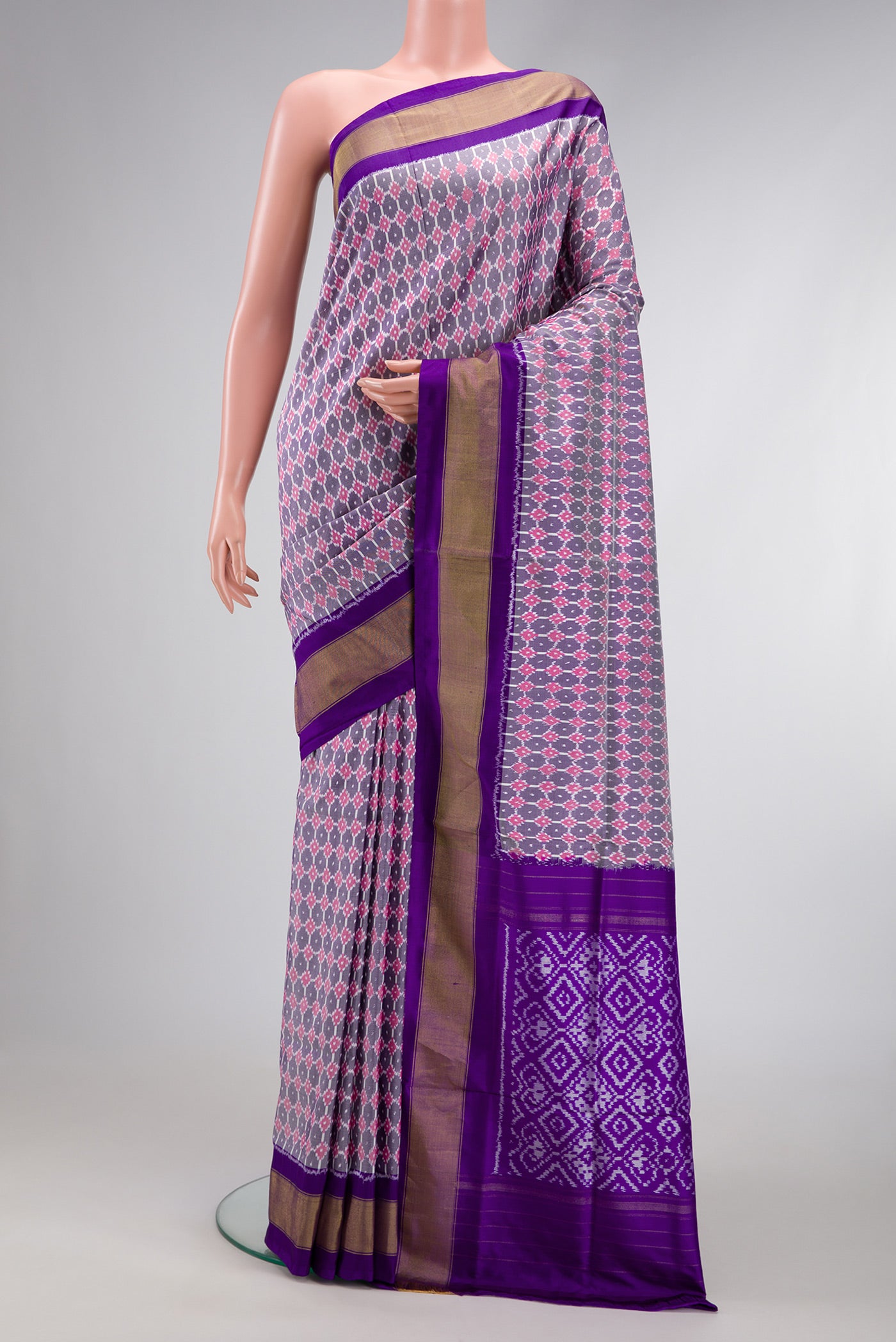 Grey Dual Tone Double Ikat Saree with Ikat Print on the body and Zari Border.  displayed on a mannequin