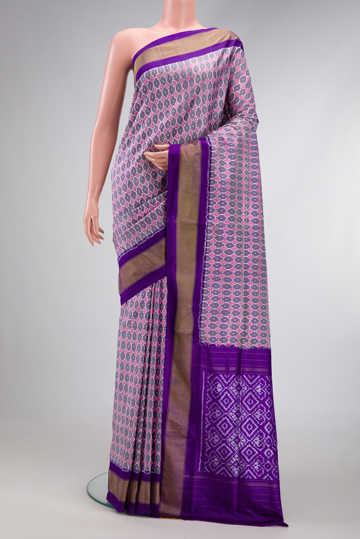 Grey Dual Tone Double Ikat Saree with Ikat Print on the body and Zari Border.  displayed on a mannequin
