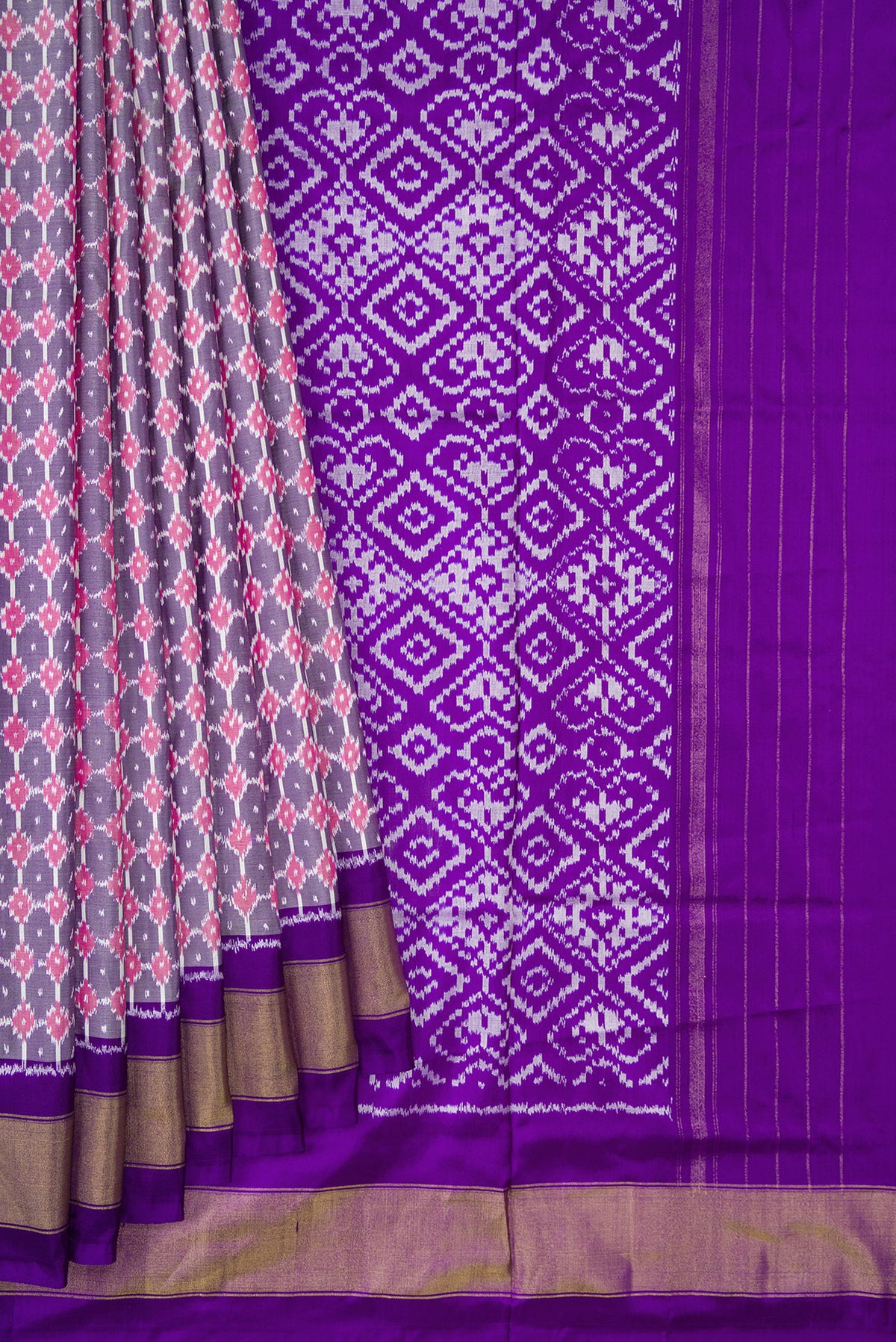 Pleats and pallu of Grey Dual Tone Double Ikat Saree with Ikat Print on the body and Zari Border. 